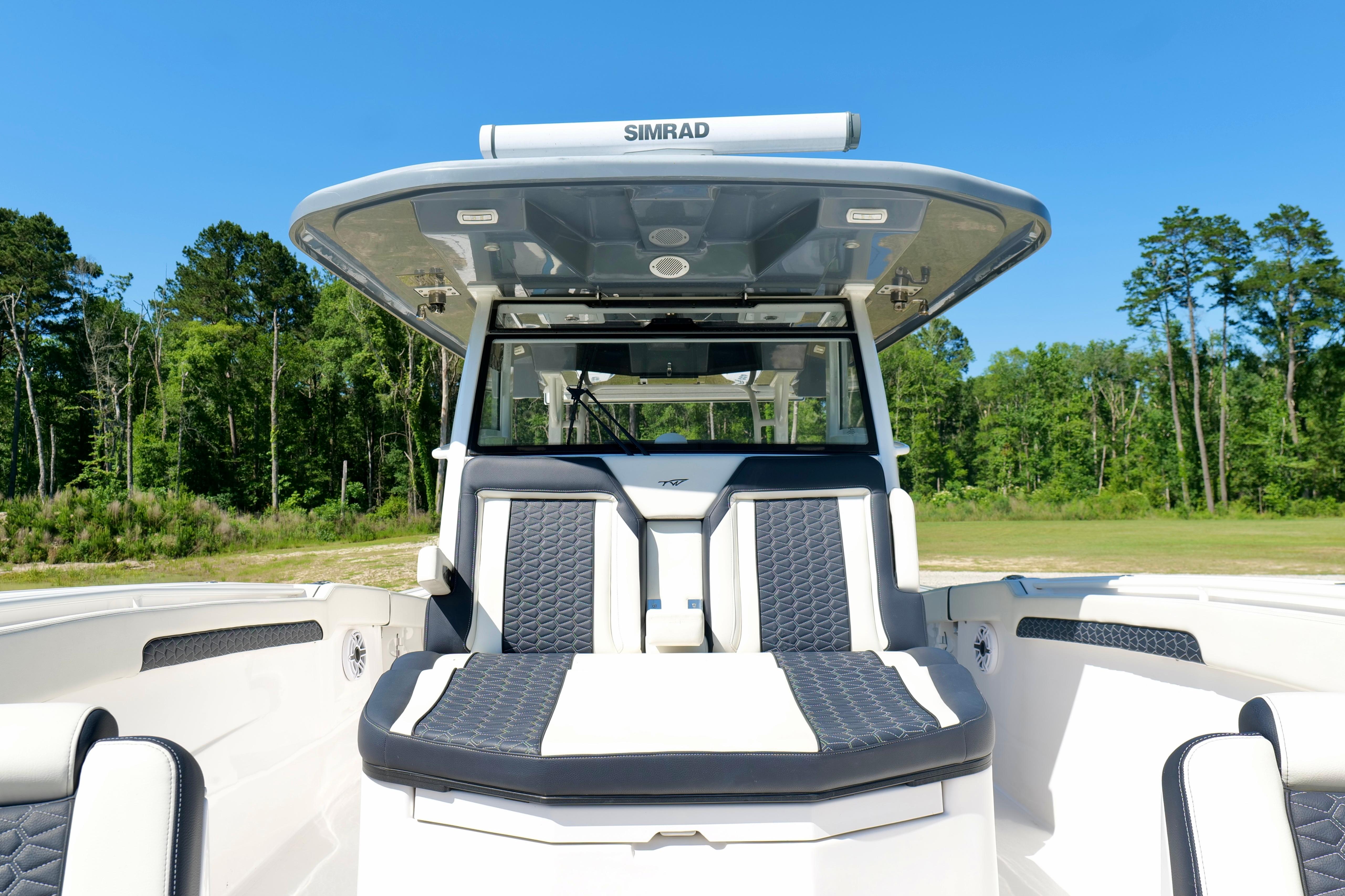 2024 Tidewater 380 CC Adventure boat with sleek seating and advanced navigation system.
