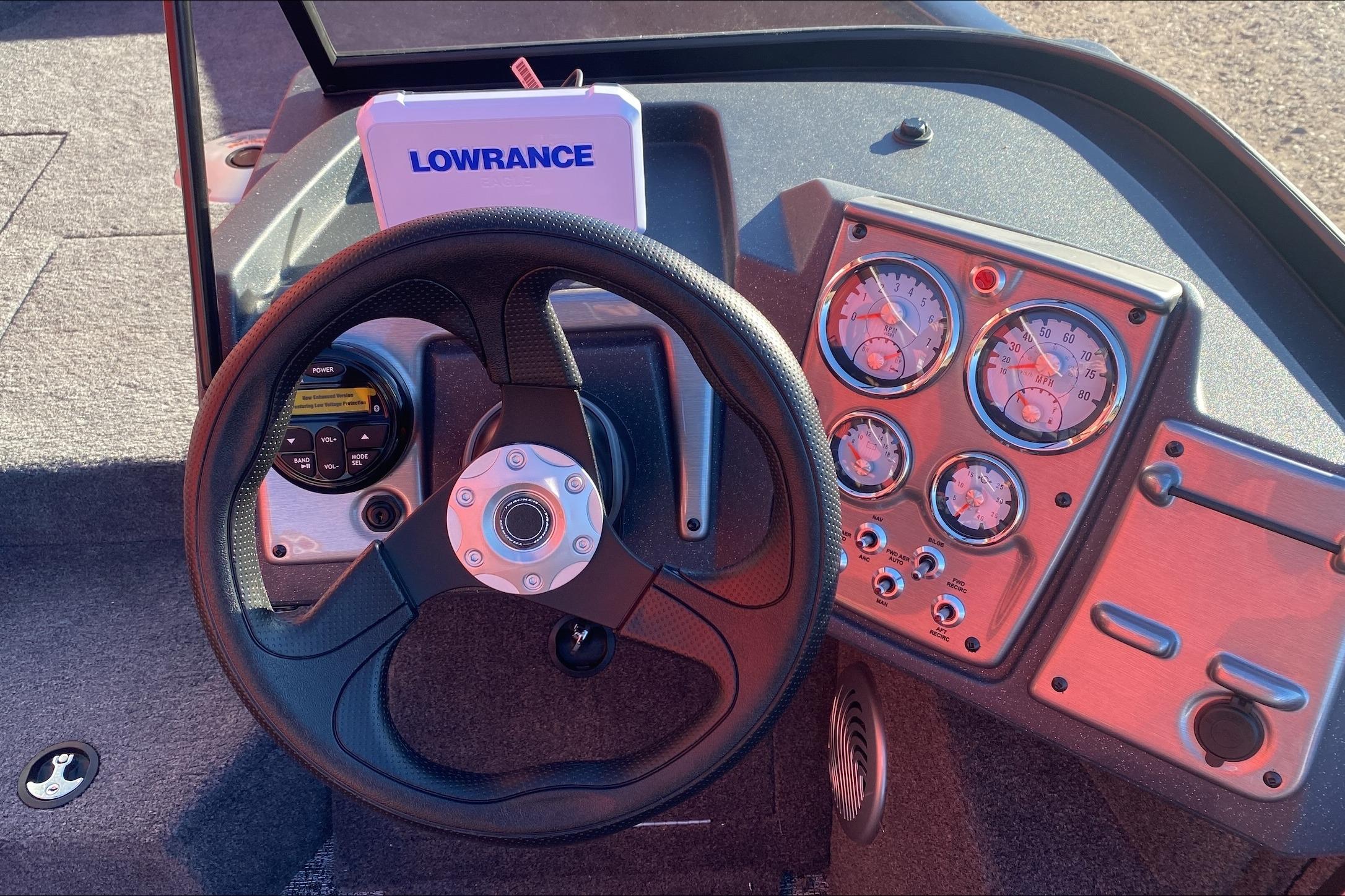 Steering wheel and dashboard of 2026 Tracker Pro Guide V-175 WT boat with Lowrance system.