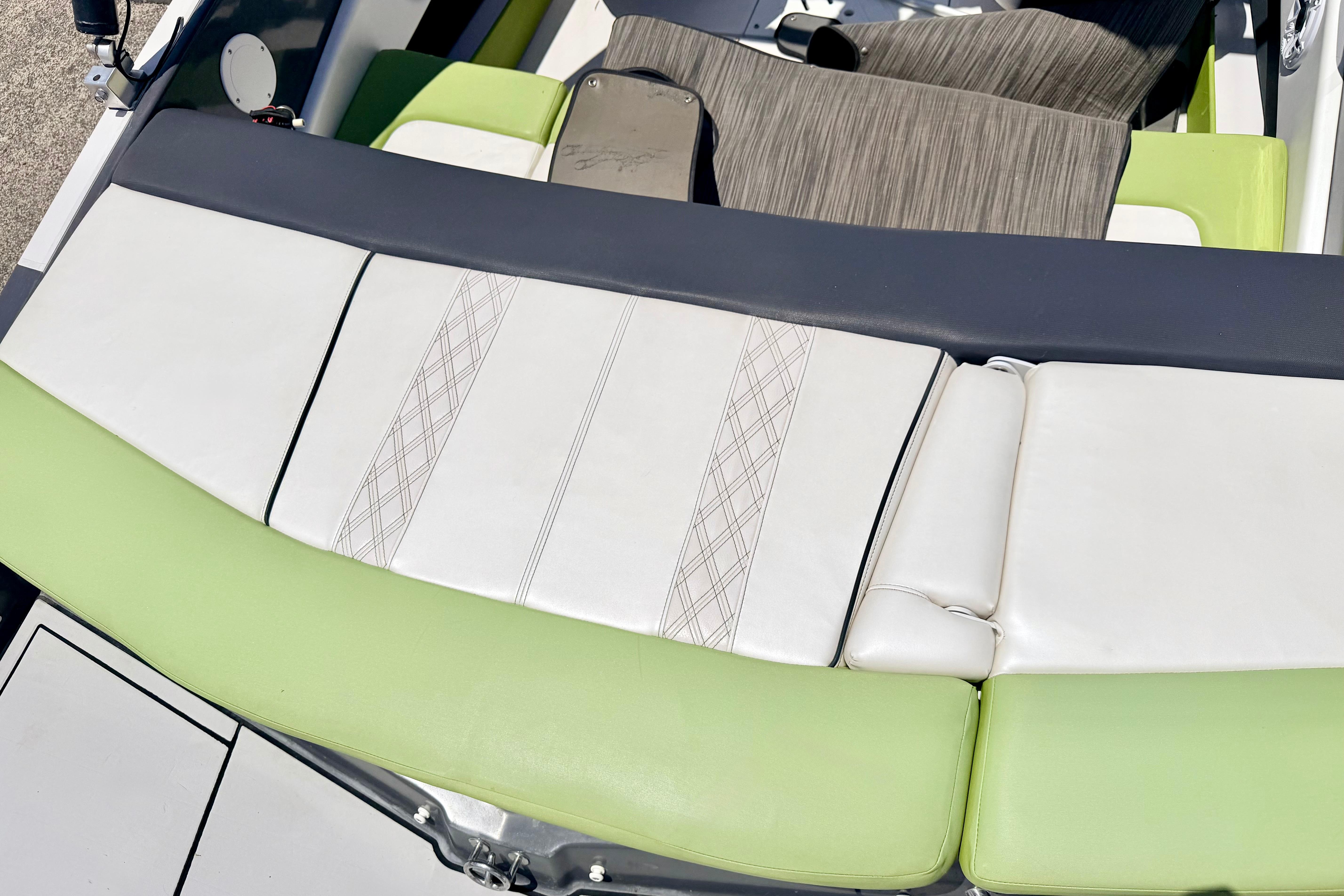 2018 Glastron GT 185 boat interior with green and white seating.