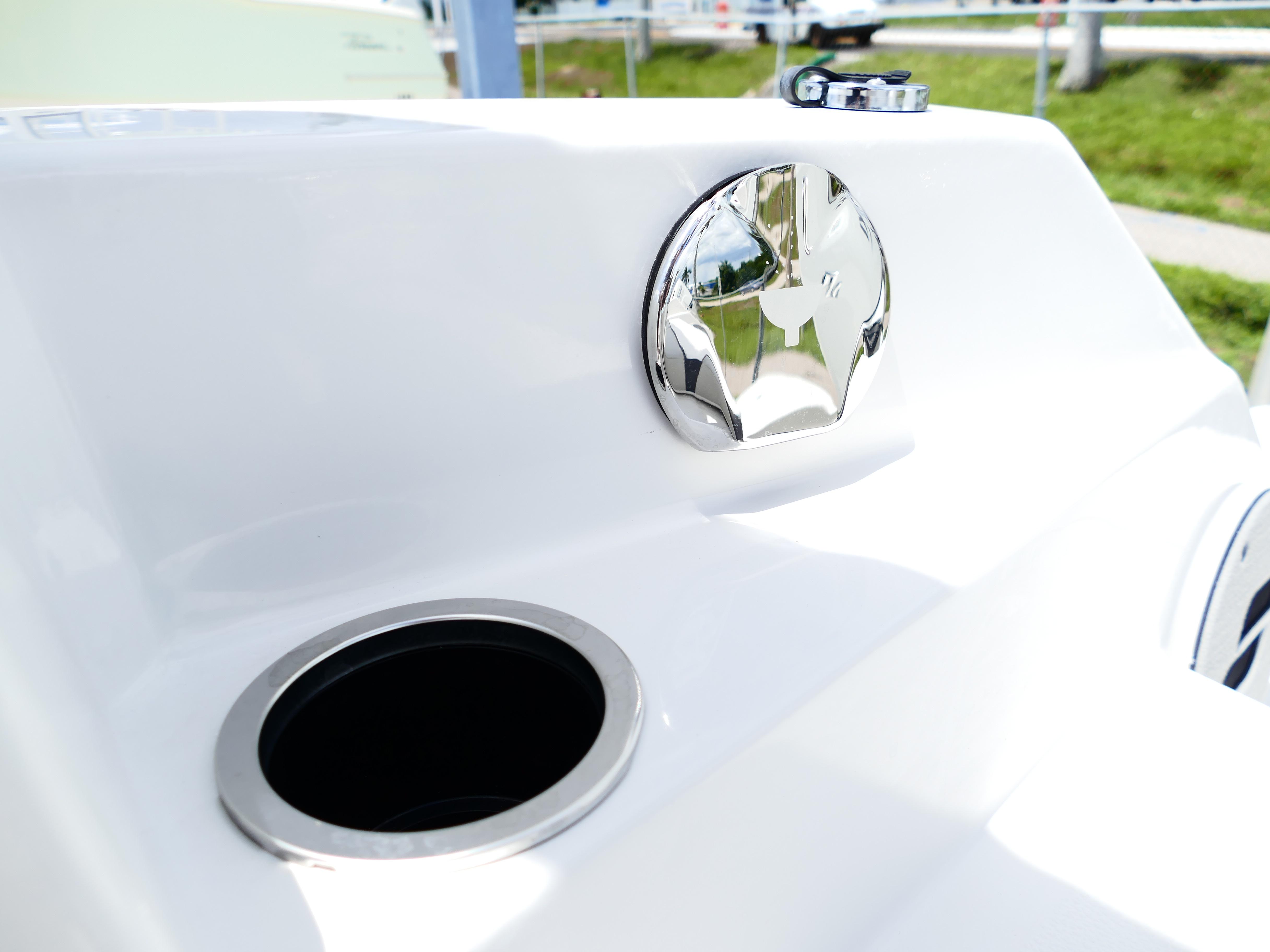 2026 Starcraft SVX 231 OB DH boat detail with chrome accents and cup holder.