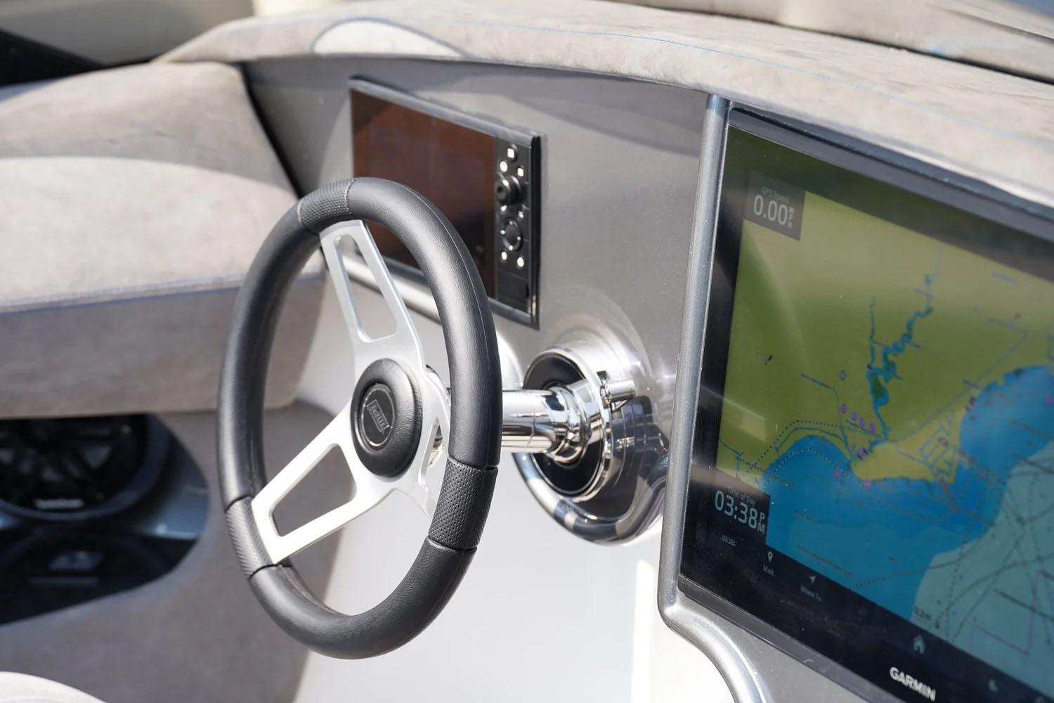 Manufacturer Provided Image: Steering wheel and navigation display of 2026 Statement 360 CAT boat.