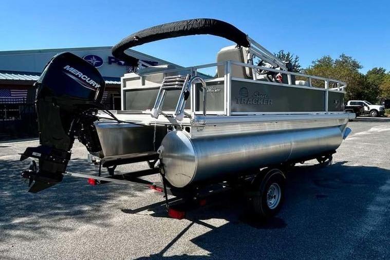 2026 Sun Tracker Bass Buggy 16 XL Select pontoon boat with Mercury outboard motor.