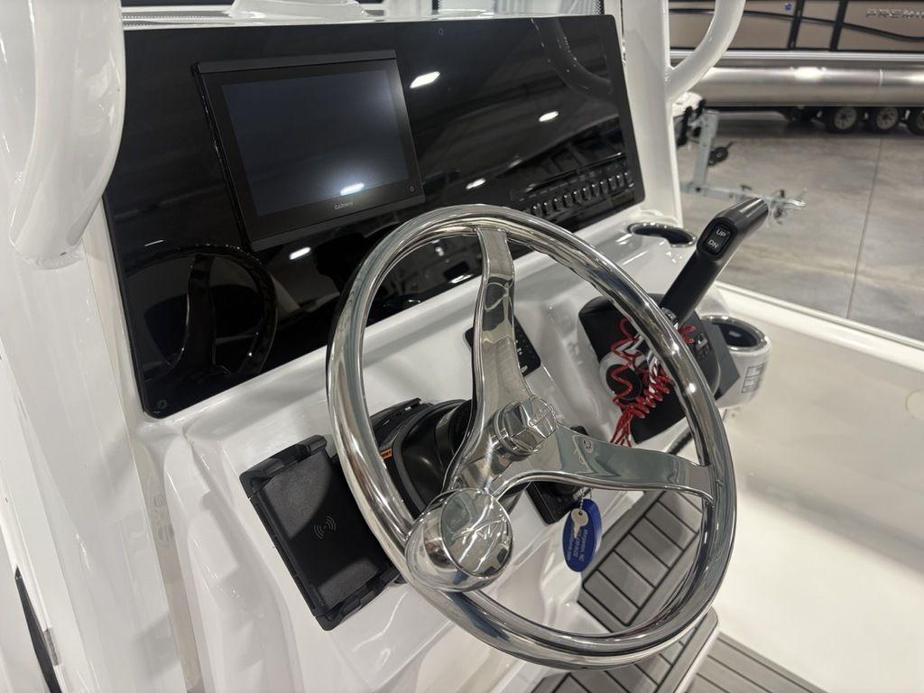 2026 Tidewater 2110 BM boat console with steering wheel and control panel.