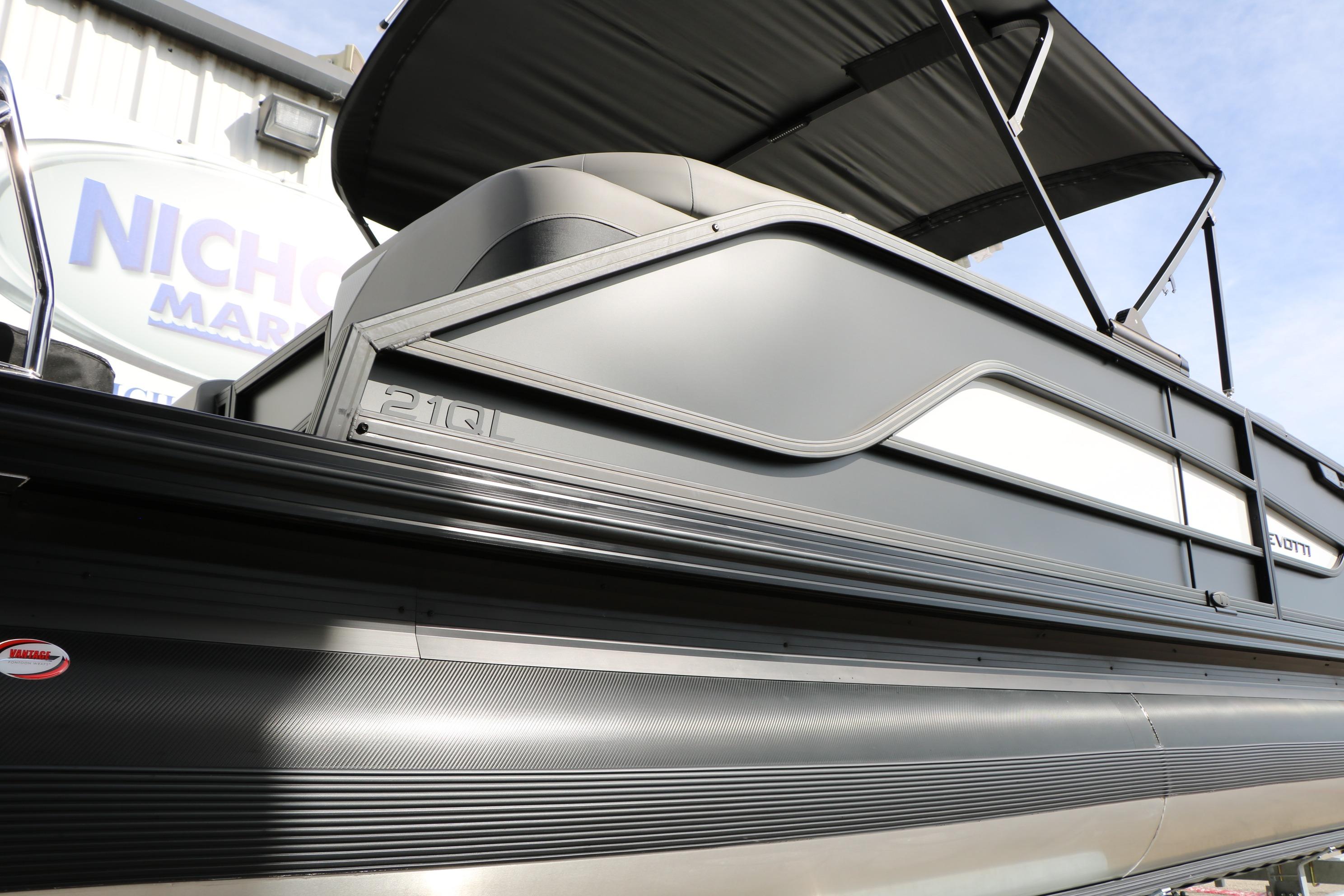 2026 Evotti 521QL pontoon boat with sleek design and canopy, displayed outdoors.