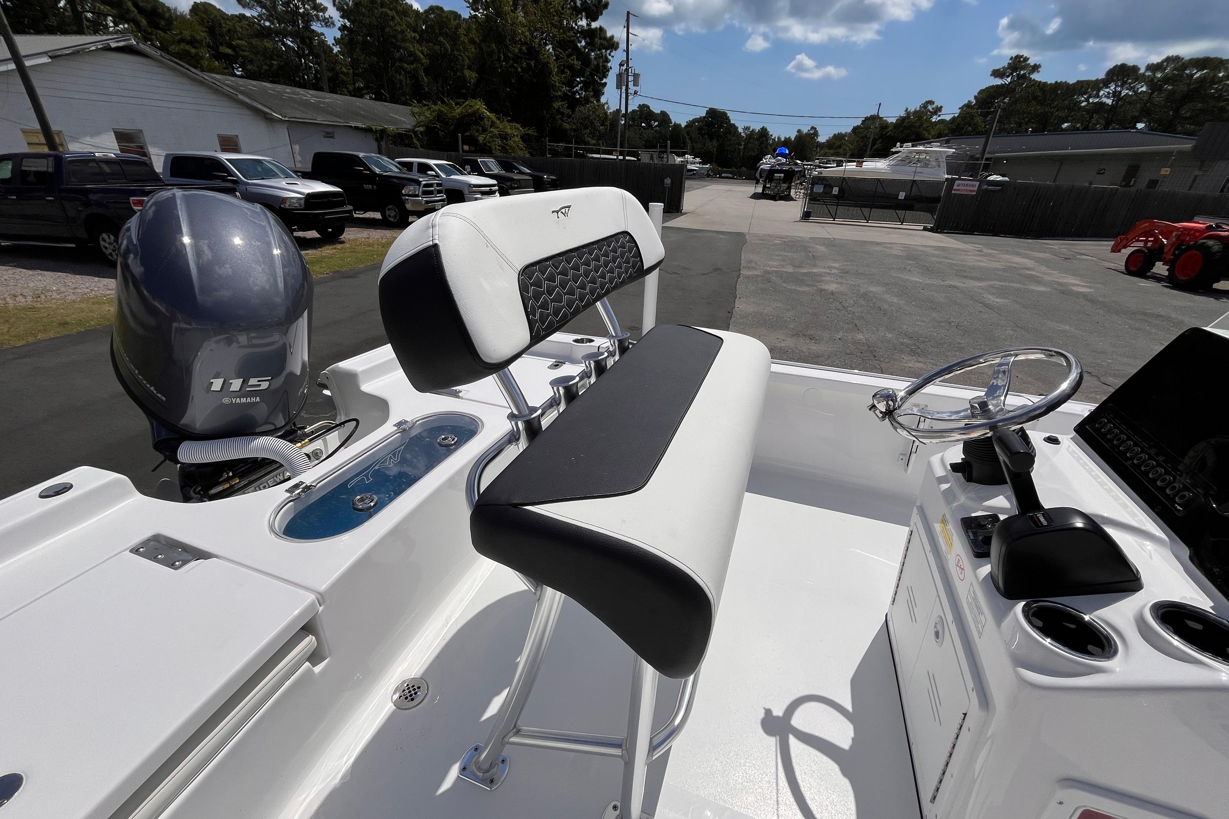 2026 Tidewater 1910 Bay Max boat interior with Yamaha 115 engine, featuring sleek seating and controls.