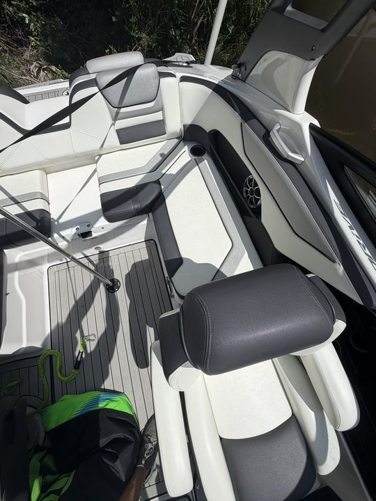 Interior of a 2022 Yamaha 212SD boat with white and gray seating.