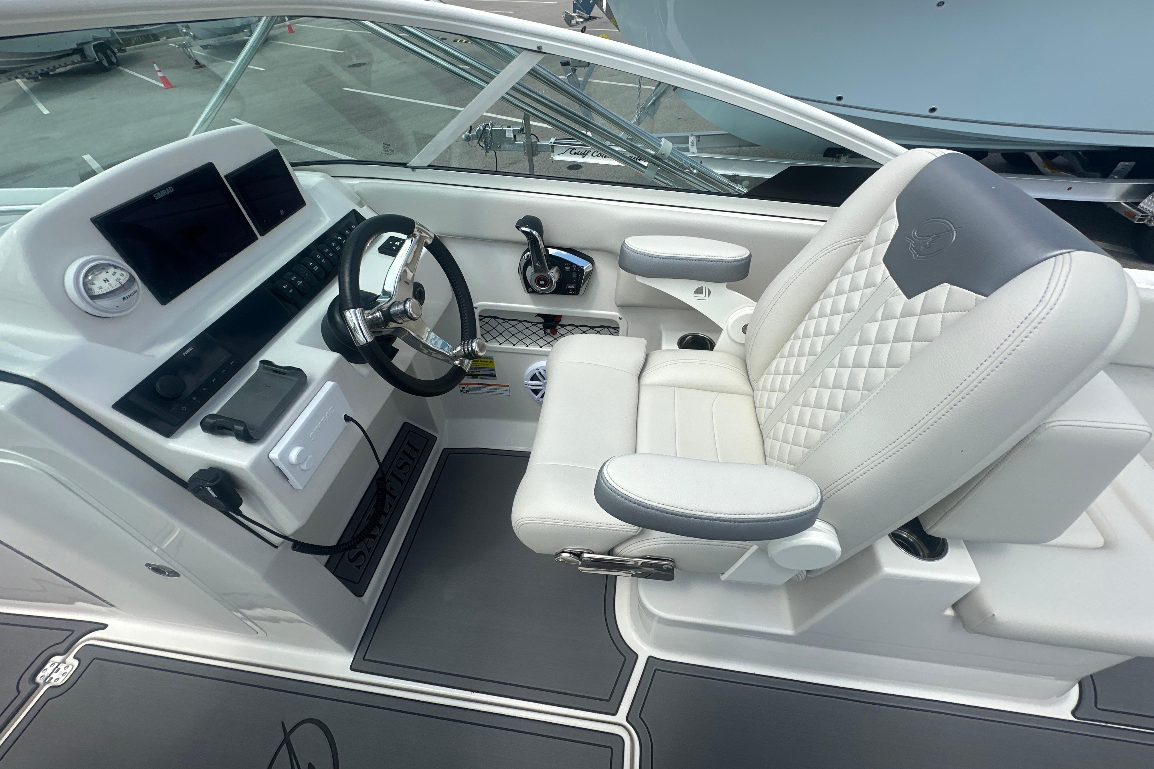 2026 Sailfish 226 DC boat cockpit with modern steering and luxurious seating.