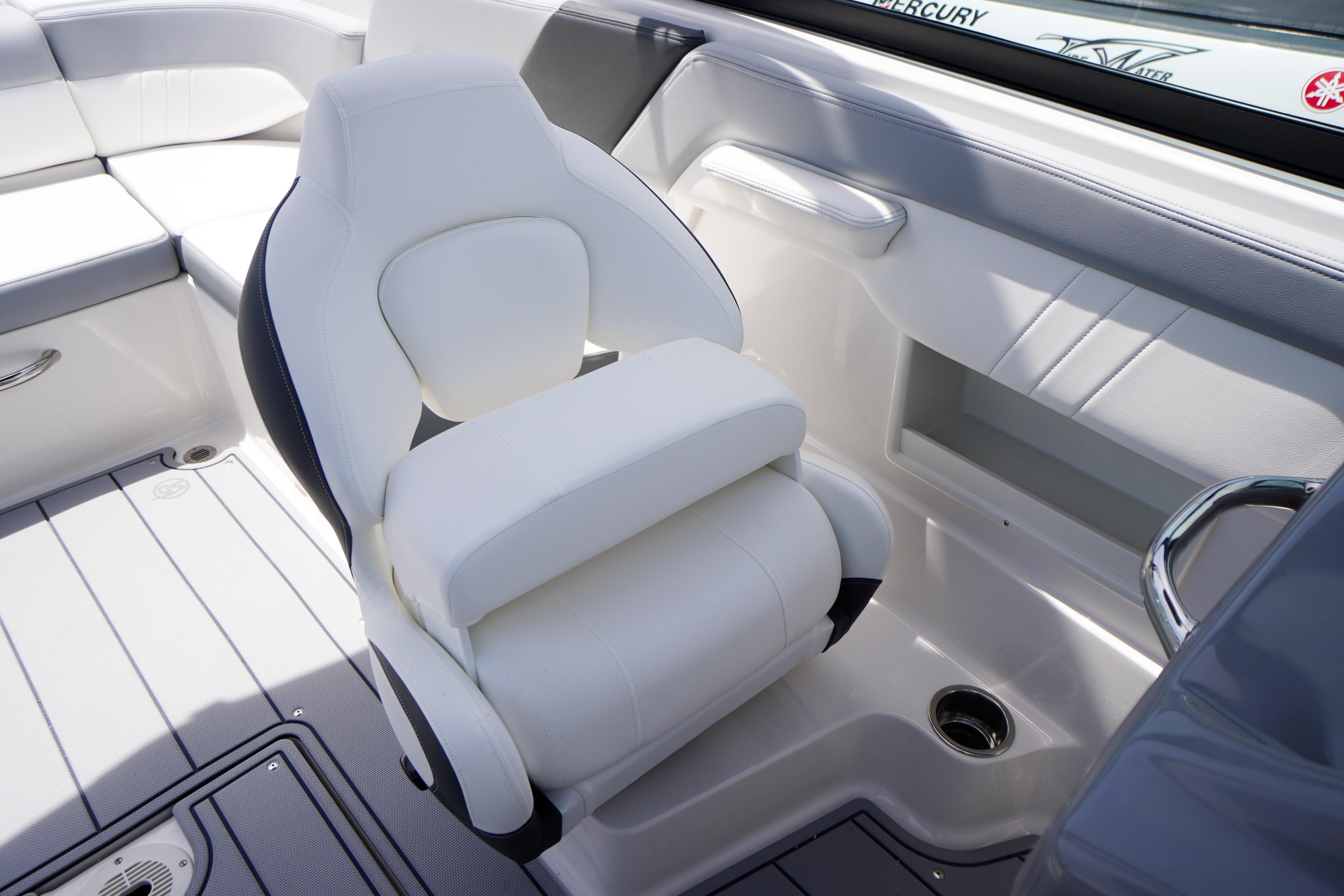 Luxury seating in 2026 Chaparral 23 SSi OB boat, featuring sleek white upholstery and modern design.