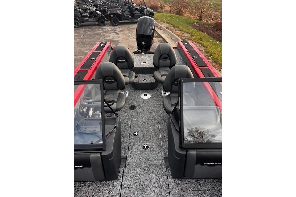 2026 Tracker Targa V-18 WT boat interior with seating and windshield, parked outdoors.