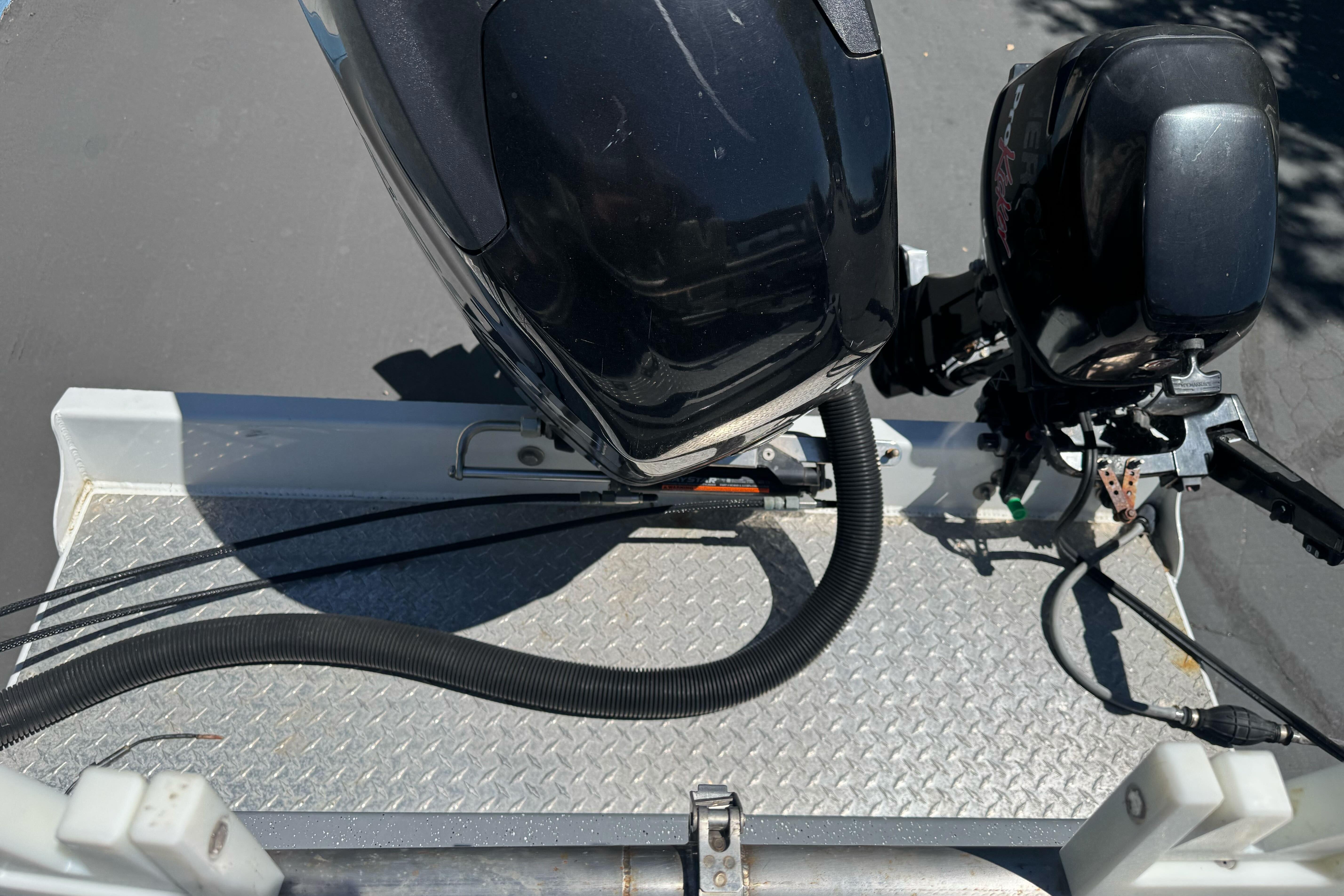 River Hawk 19 GB 2014 boat motor on metal platform, viewed from above.