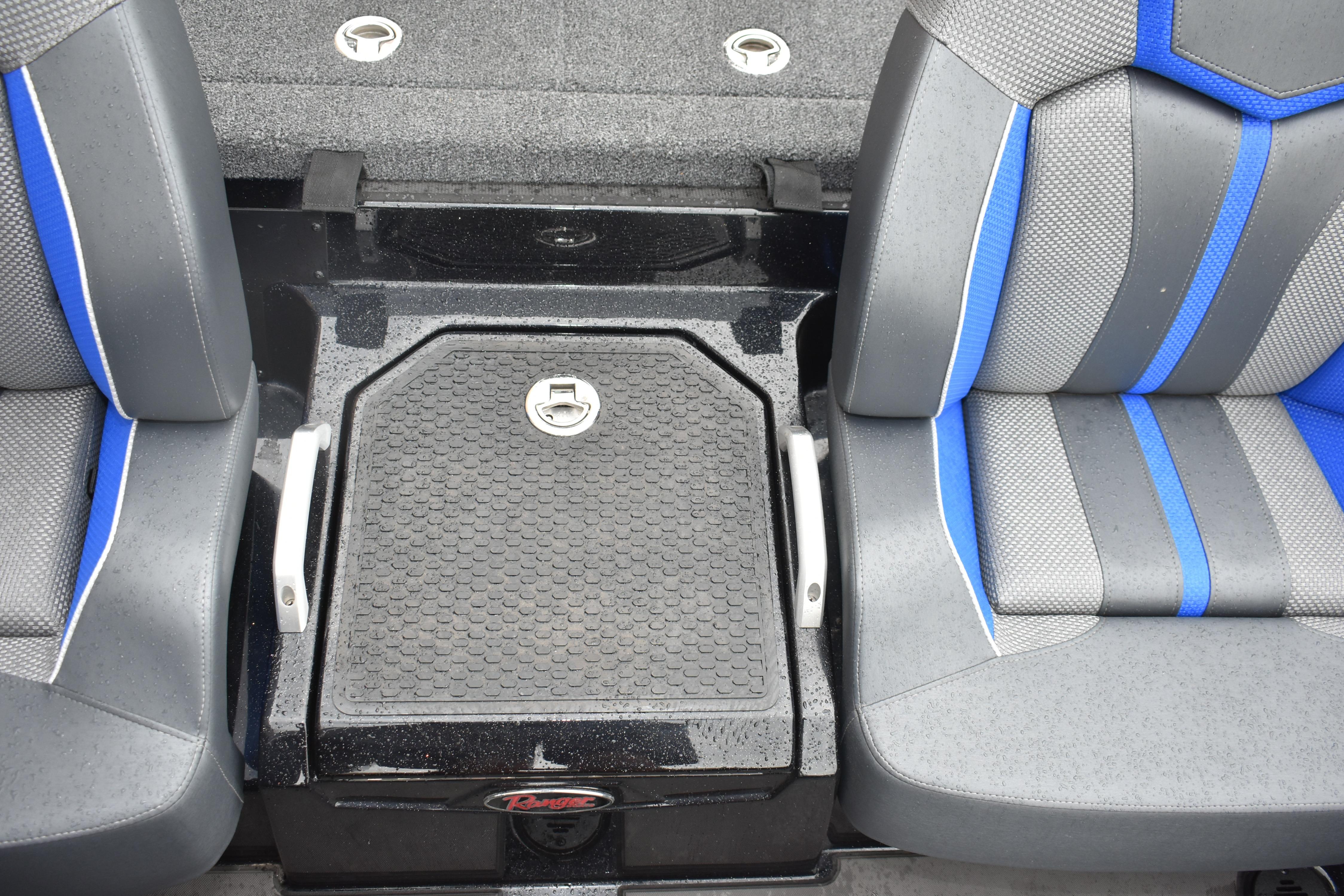 2025 Ranger Z521 boat interior with gray and blue seats and storage compartment.