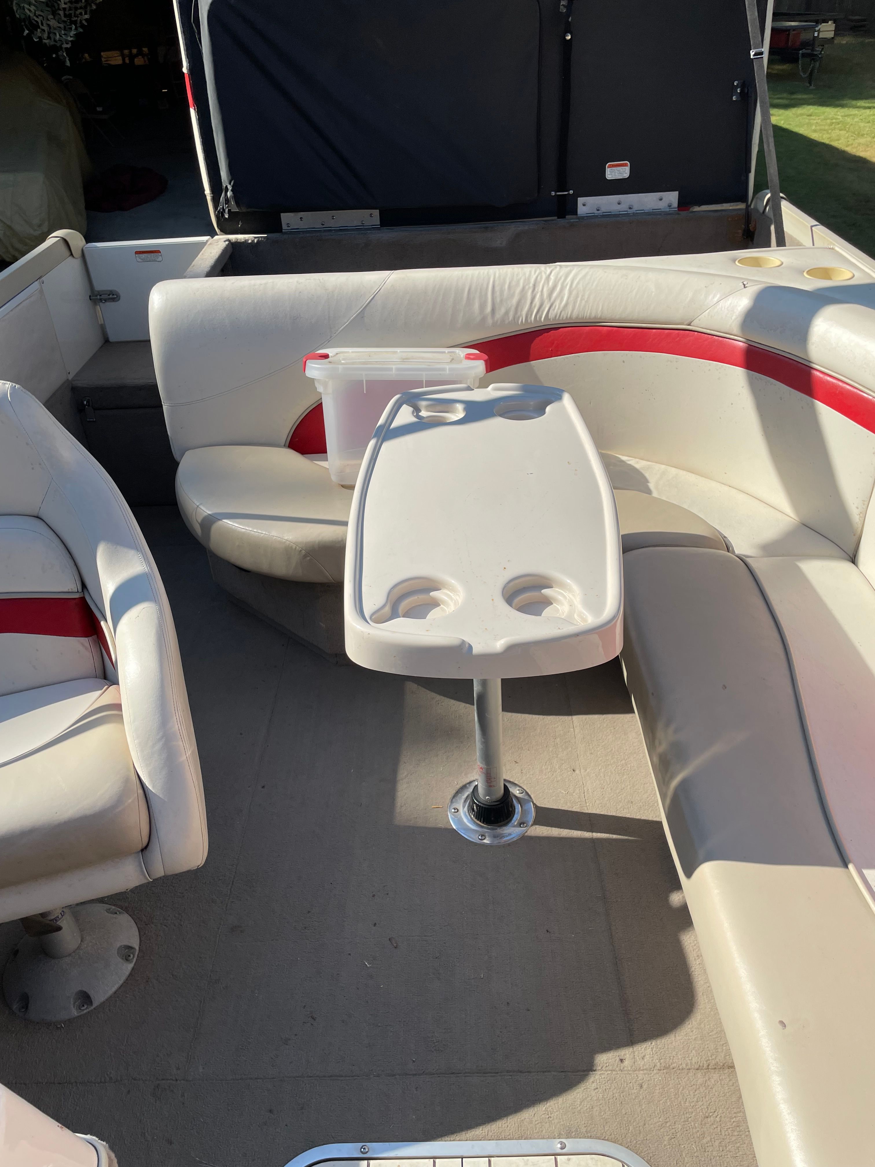 Interior of a 2005 Sun Tracker Party Deck 21 I/O boat with seating area.