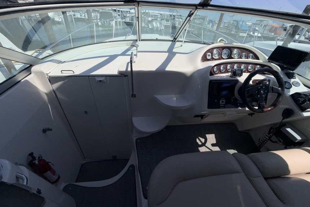 Cockpit view of a 2001 Monterey 282 Cruiser with steering wheel and control panel.