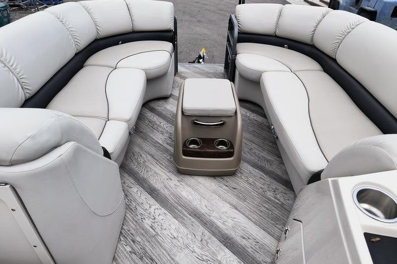 Luxurious seating on 2017 Manitou 25 Oasis SE pontoon boat with elegant interior design.