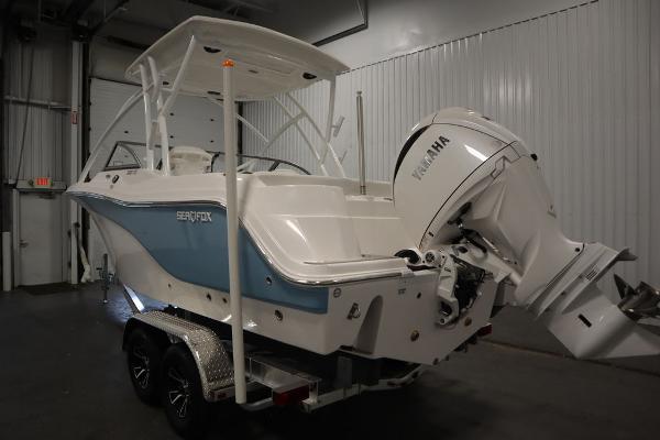 2025 Sea Fox 228 Traveler boat with Yamaha engine in indoor storage.