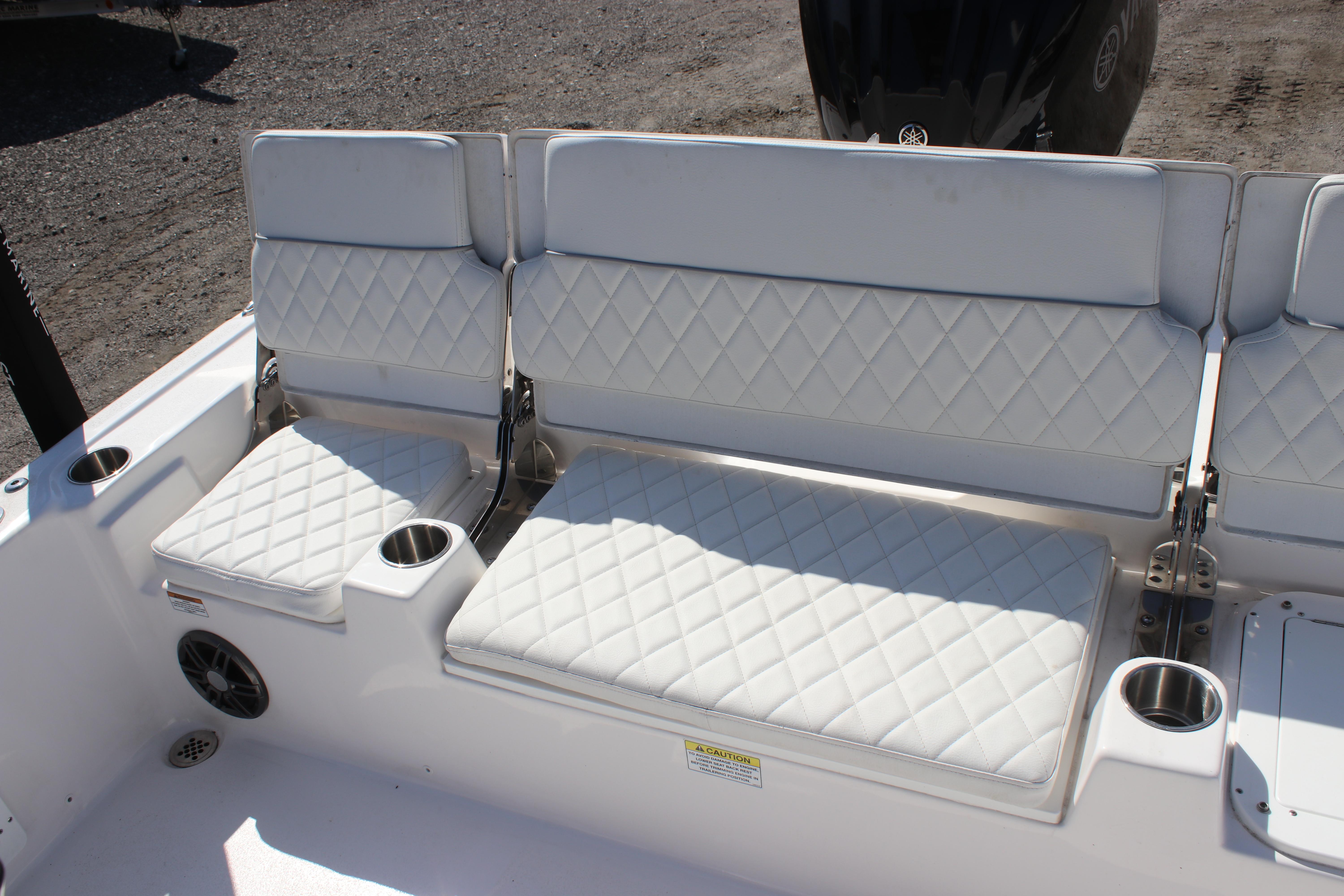 2025 Sea Fox 251 Bay Fox boat seating with diamond-stitched upholstery and cup holders.