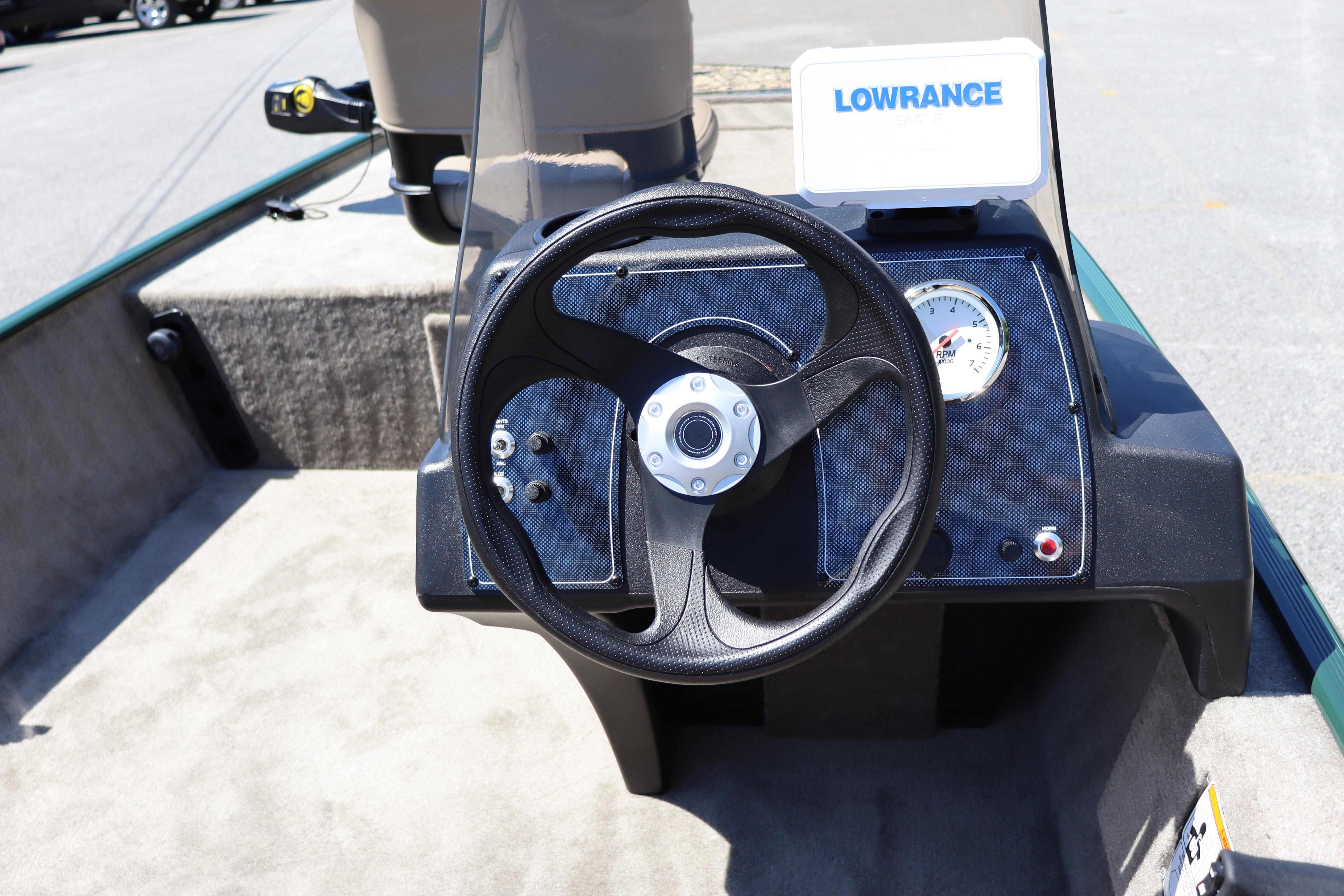 Steering console of 2026 Tracker Bass Tracker Classic Limited boat with Lowrance display.