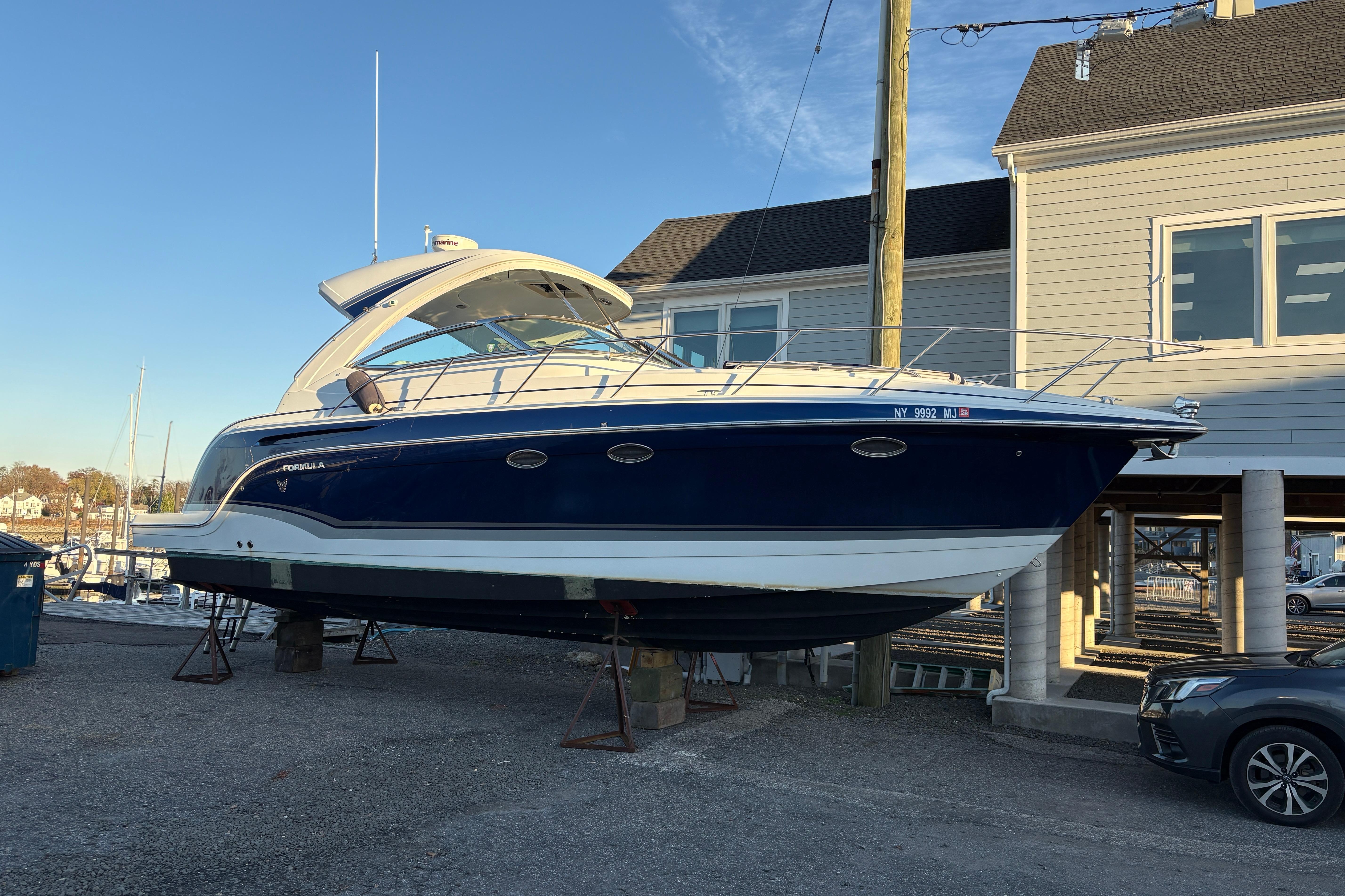 2011 Formula 34 Performance Cruiser boat on dry dock near marina.