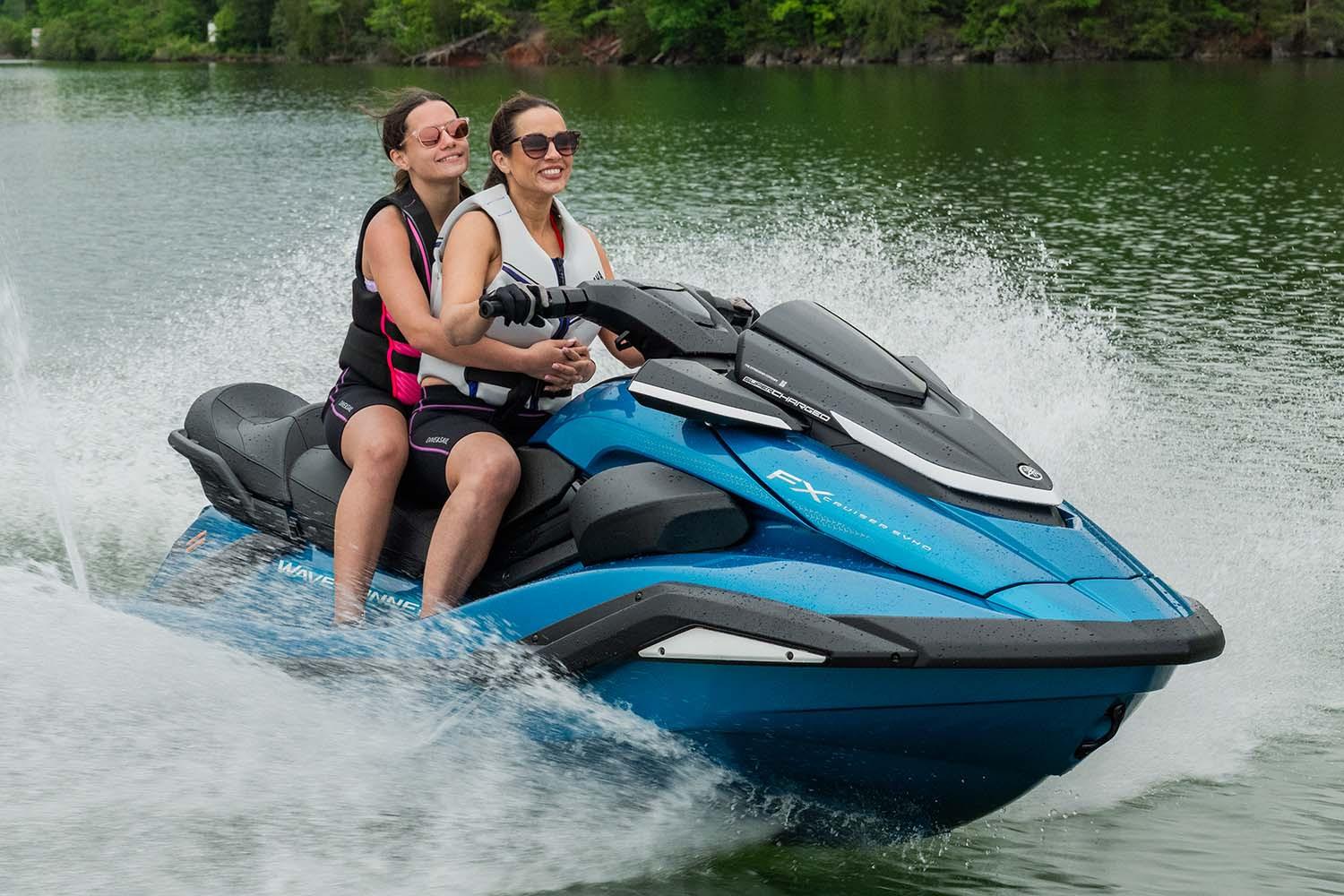 Manufacturer Provided Image: Two people riding a 2026 Yamaha WaveRunner FX Cruiser SVHO on a lake.