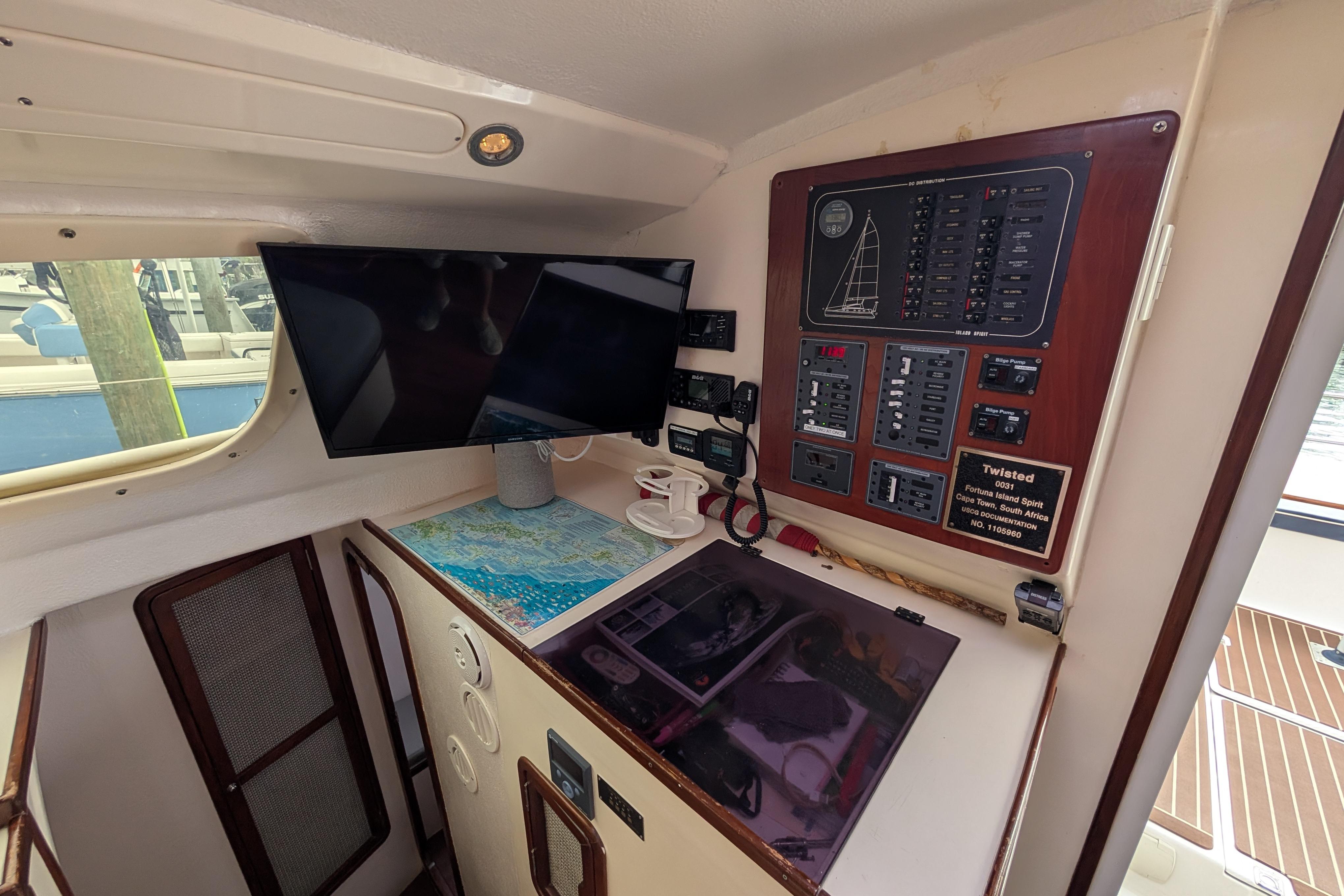 Interior of 1999 Island Spirit 37 yacht with navigation panel and map.