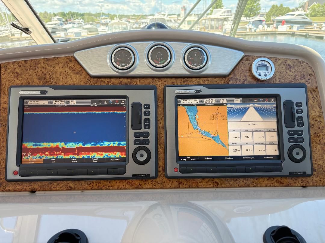 Dashboard of a 2011 Formula 45 with two large navigation screens and instruments.