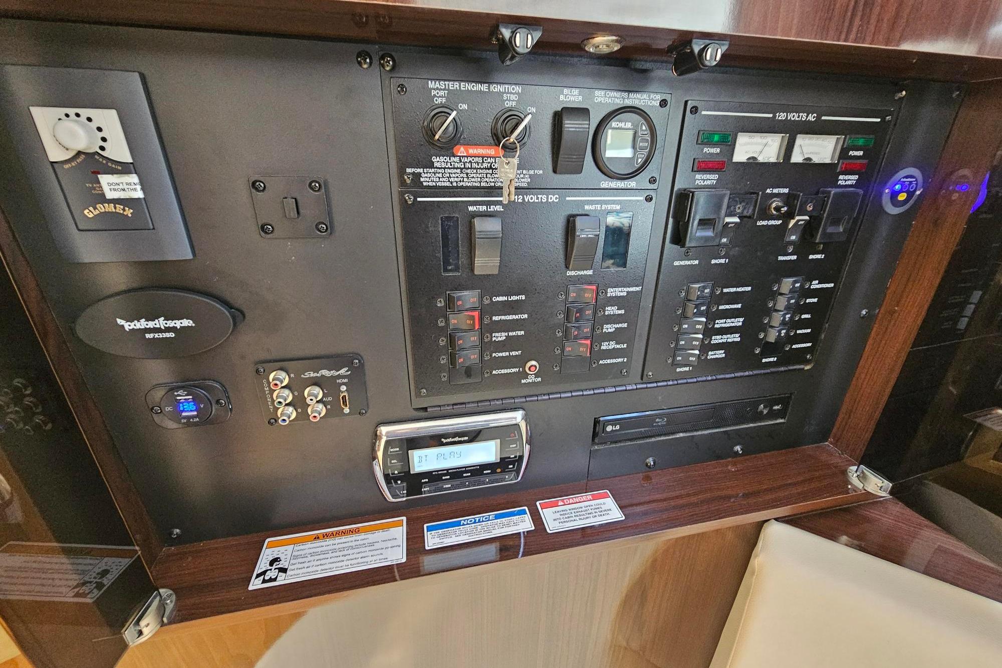Control panel of a 2016 Sea Ray Sundancer 350 yacht with various switches and indicators.