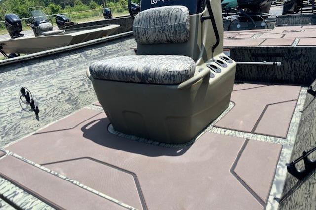2026 Tracker Grizzly 2072 CC boat interior with camo seating and spacious deck.