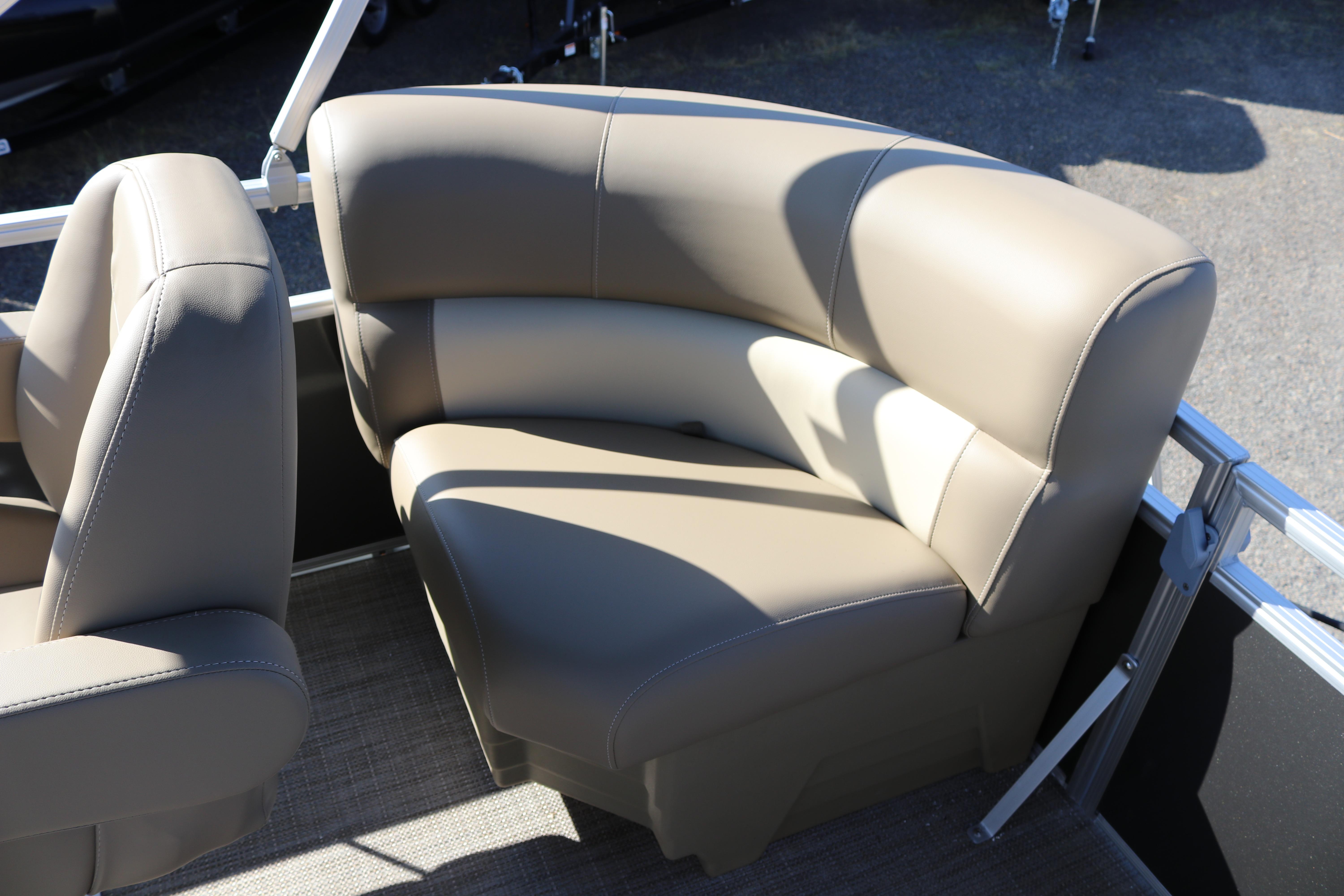 Luxurious seating on 2025 SunChaser Vista 18 Fish pontoon boat, featuring beige upholstery.