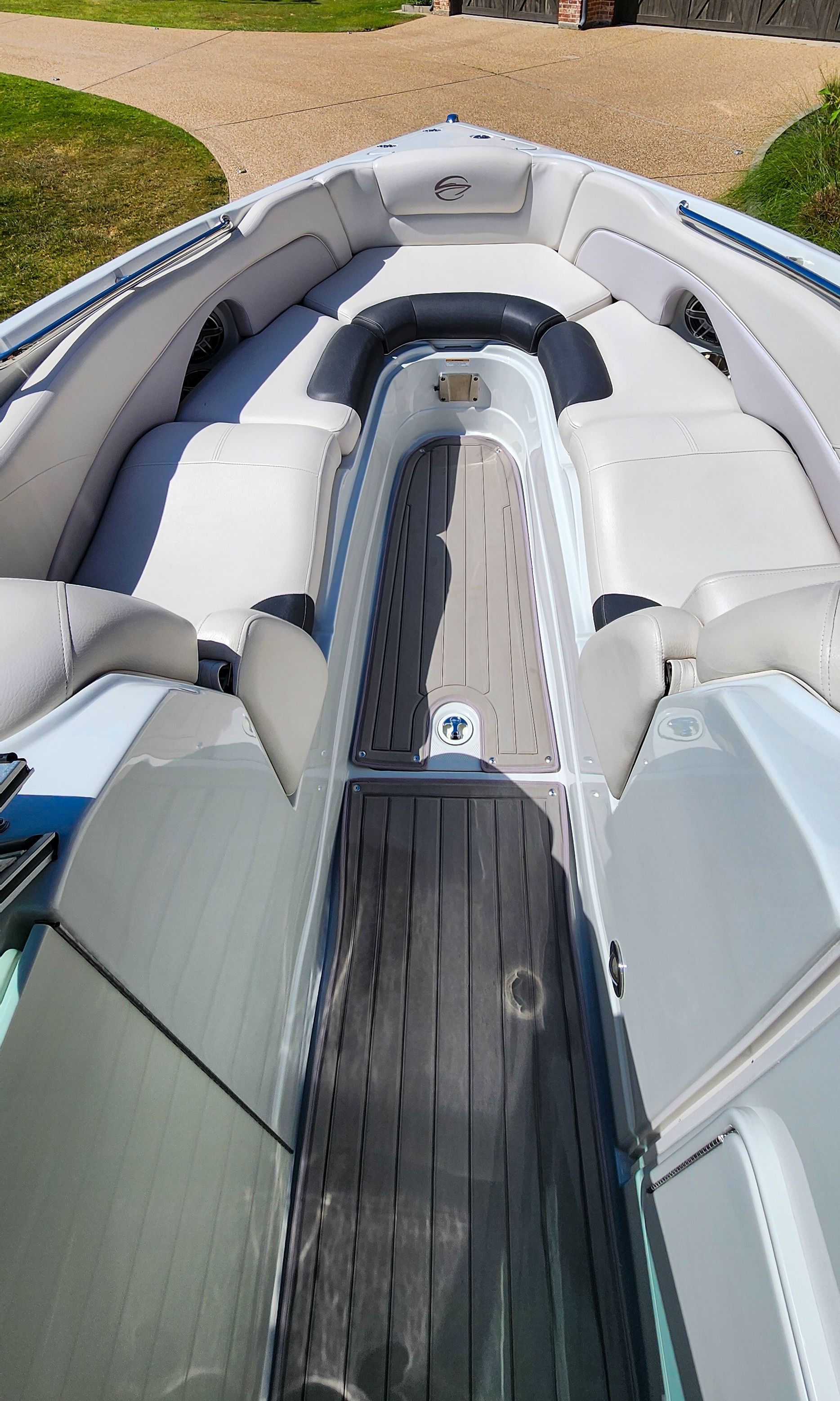 The image shows the cockpit of a 2017 Crownline 285SS boat with gray upholstery.