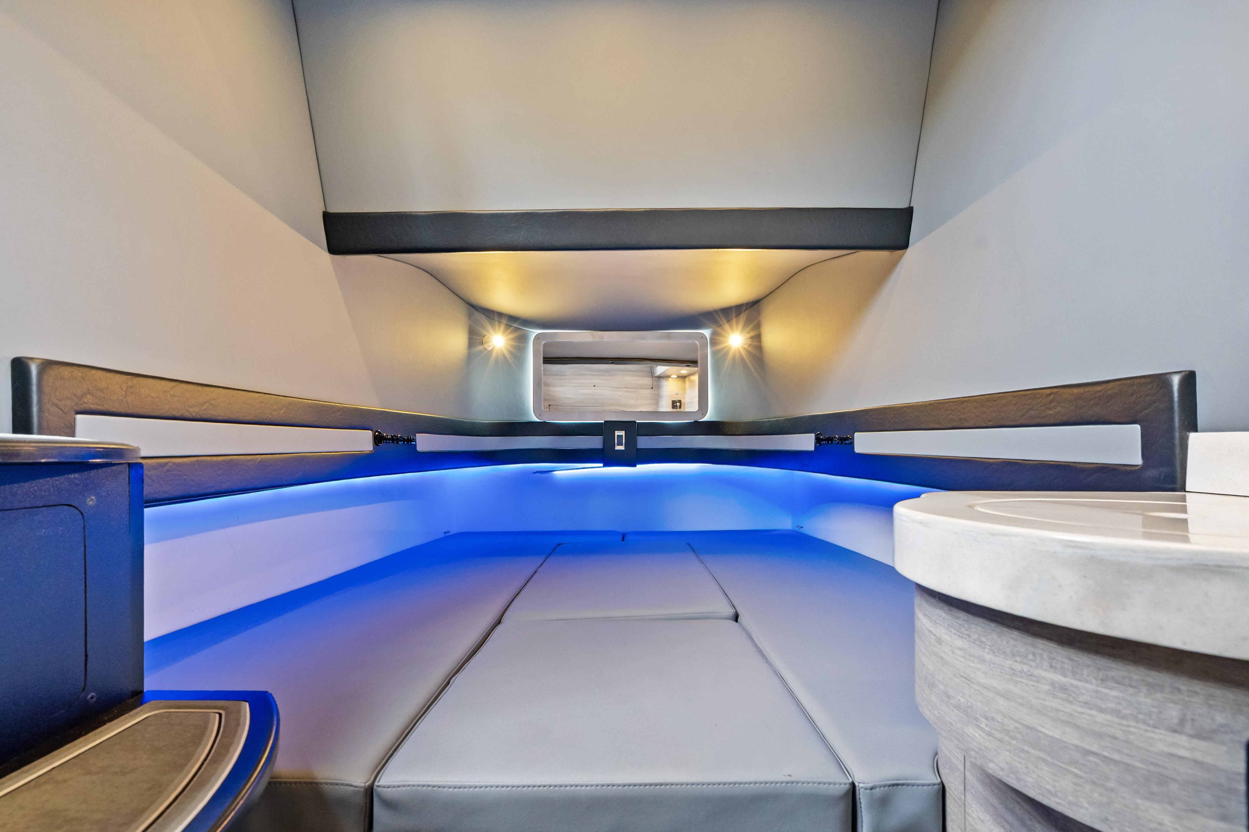 Luxurious interior of 2027 Mystic Powerboats M4200 with modern lighting and sleek design.