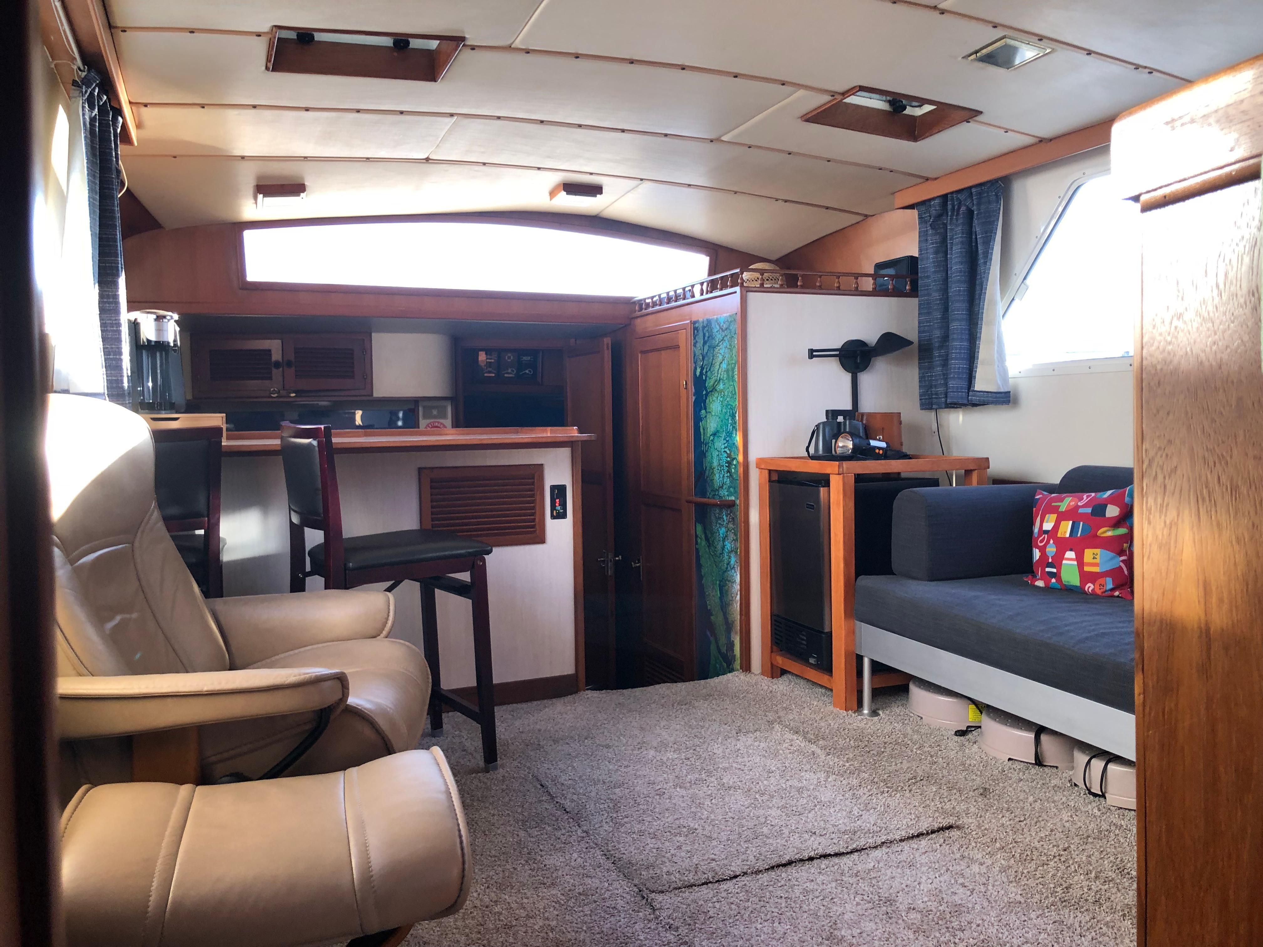 Interior of 1987 Kadey-Krogen Silhouette yacht with cozy seating and modern amenities.