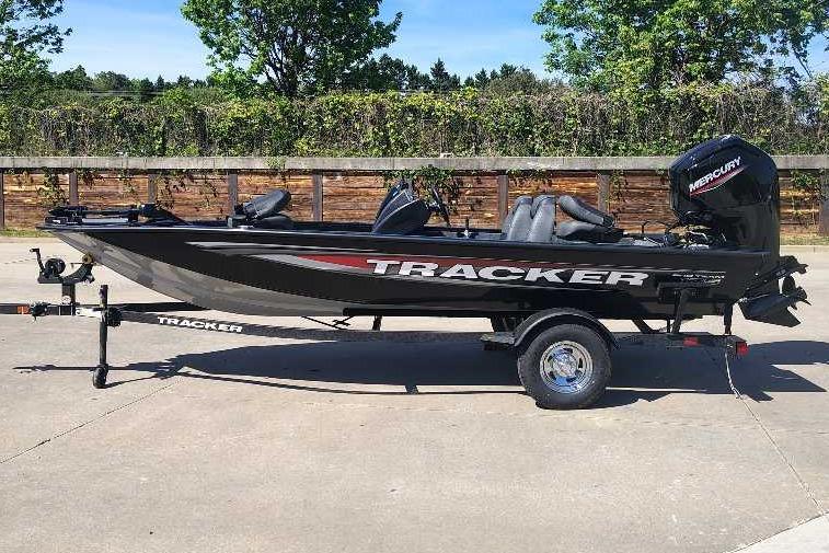 2026 Tracker Pro Team 175 boat on trailer, parked outdoors.