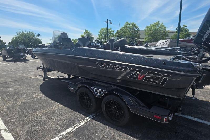2026 Nitro ZV21 boat on trailer in parking lot under clear sky.
