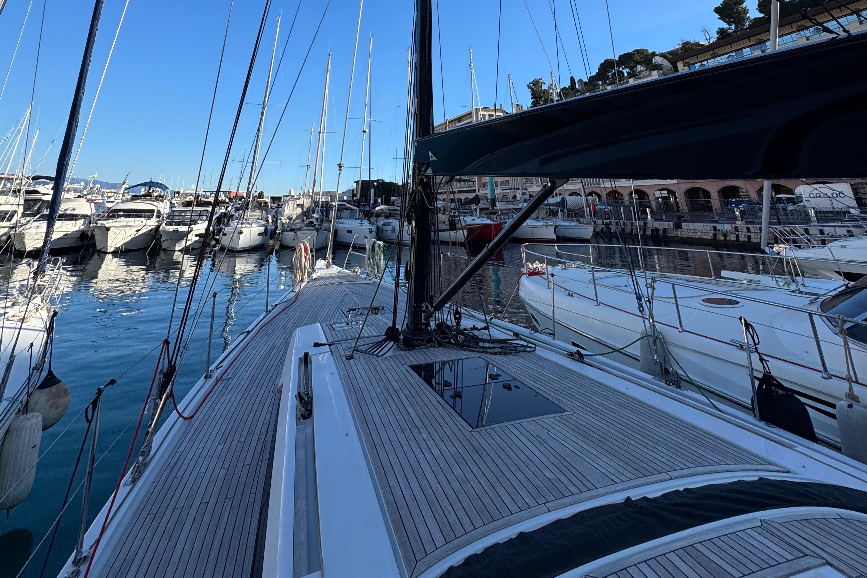 Grand Soleil 48 yacht, 2018 model, docked in a marina with other boats.