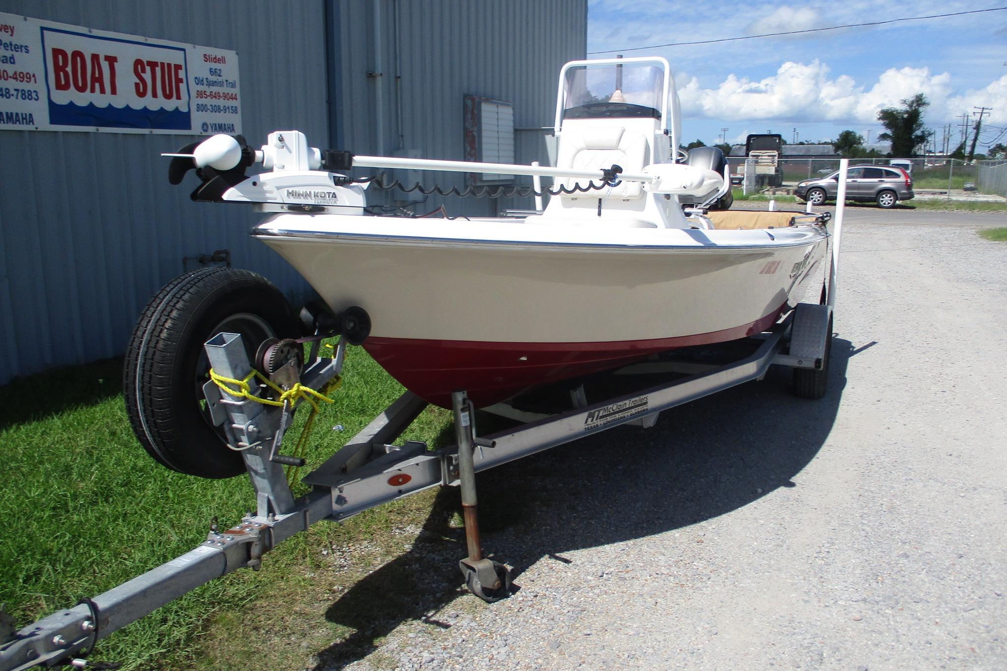 2021 Blue Wave 2000 PureBay boat on trailer outside dealership.