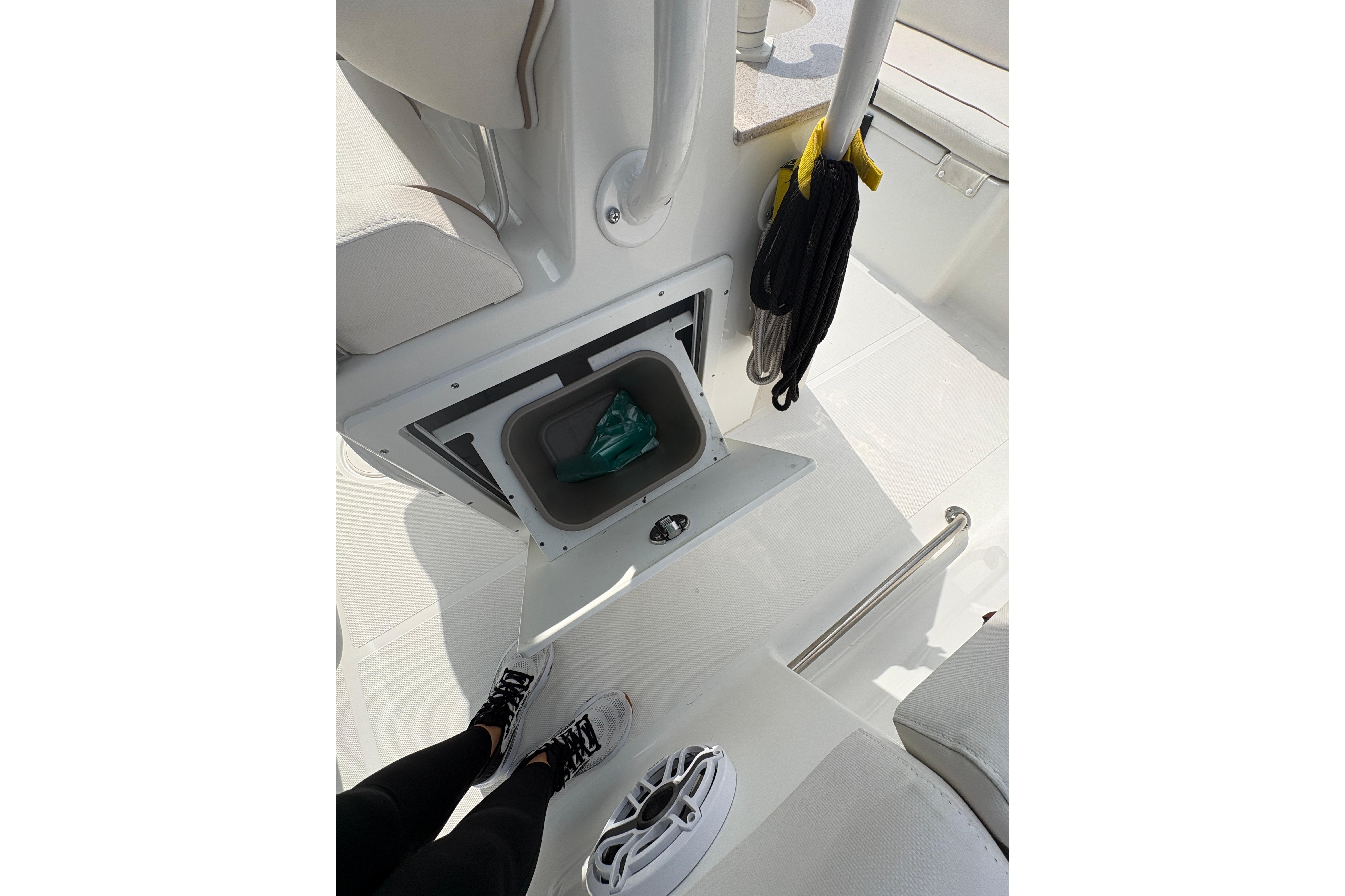 2021 Sea Hunt Ultra 265 SE boat interior with storage compartment and accessories.