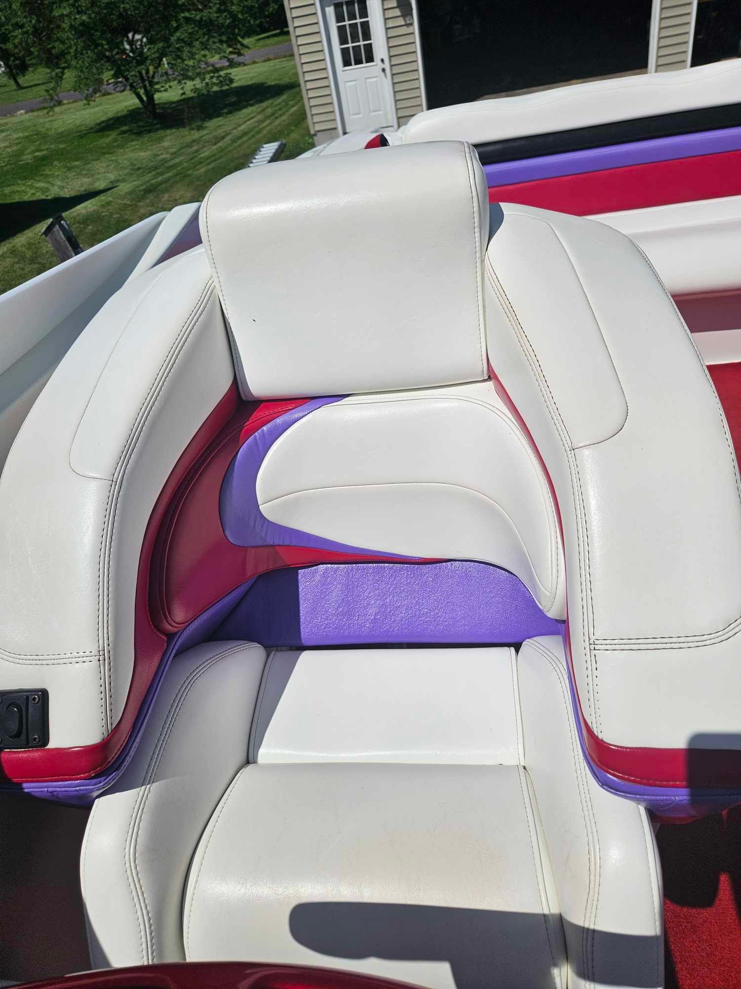 Interior of a 1997 Baja 38 Special Boss boat with colorful seating.