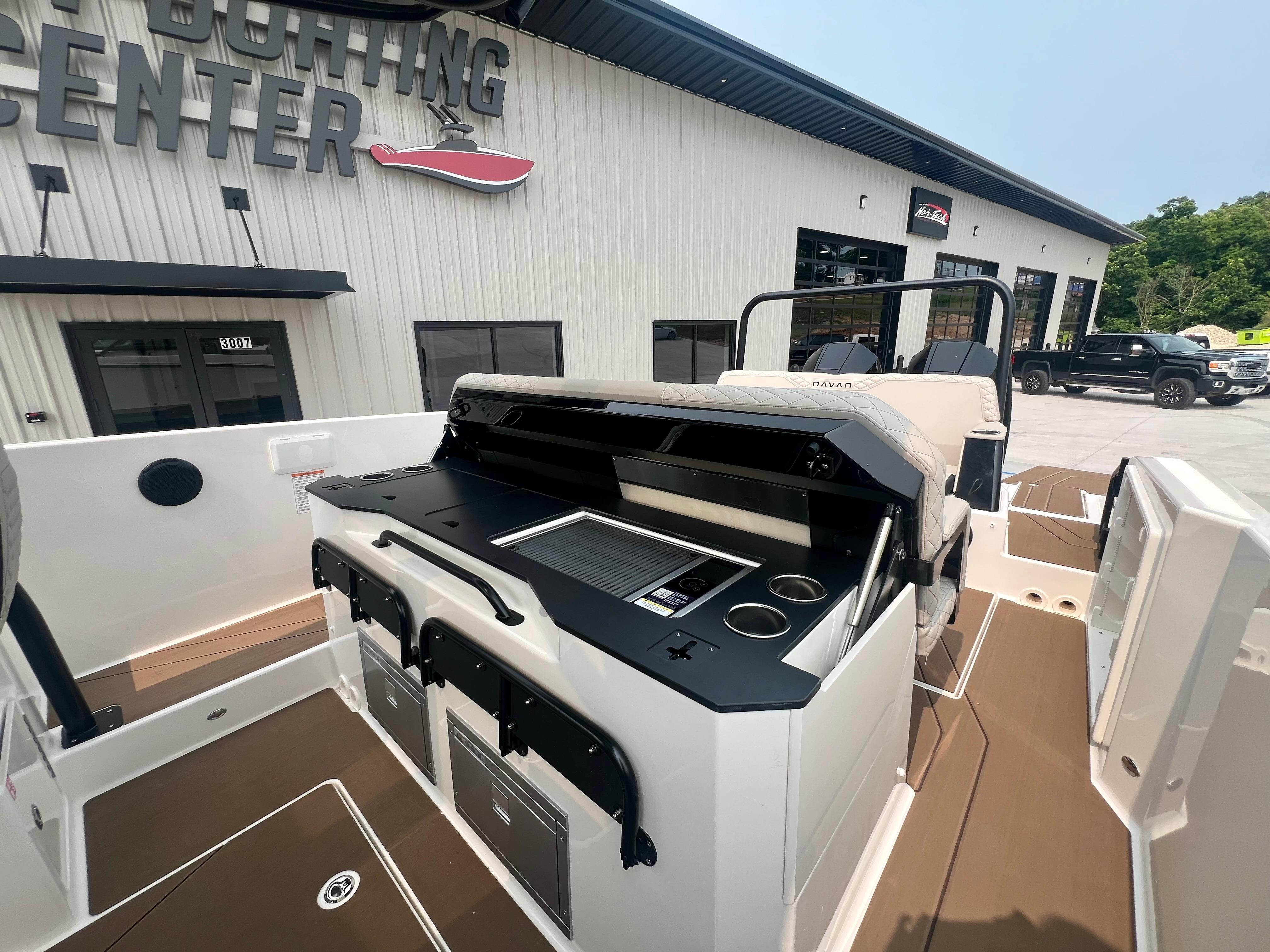 Navan S-30 boat interior with modern console, docked at a sporting center, 2025 model.