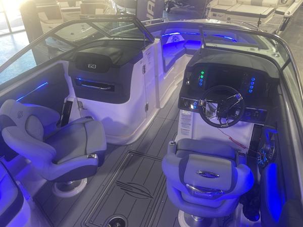 Interior of 2025 Chaparral 267 SSX boat with modern seating and illuminated dashboard.
