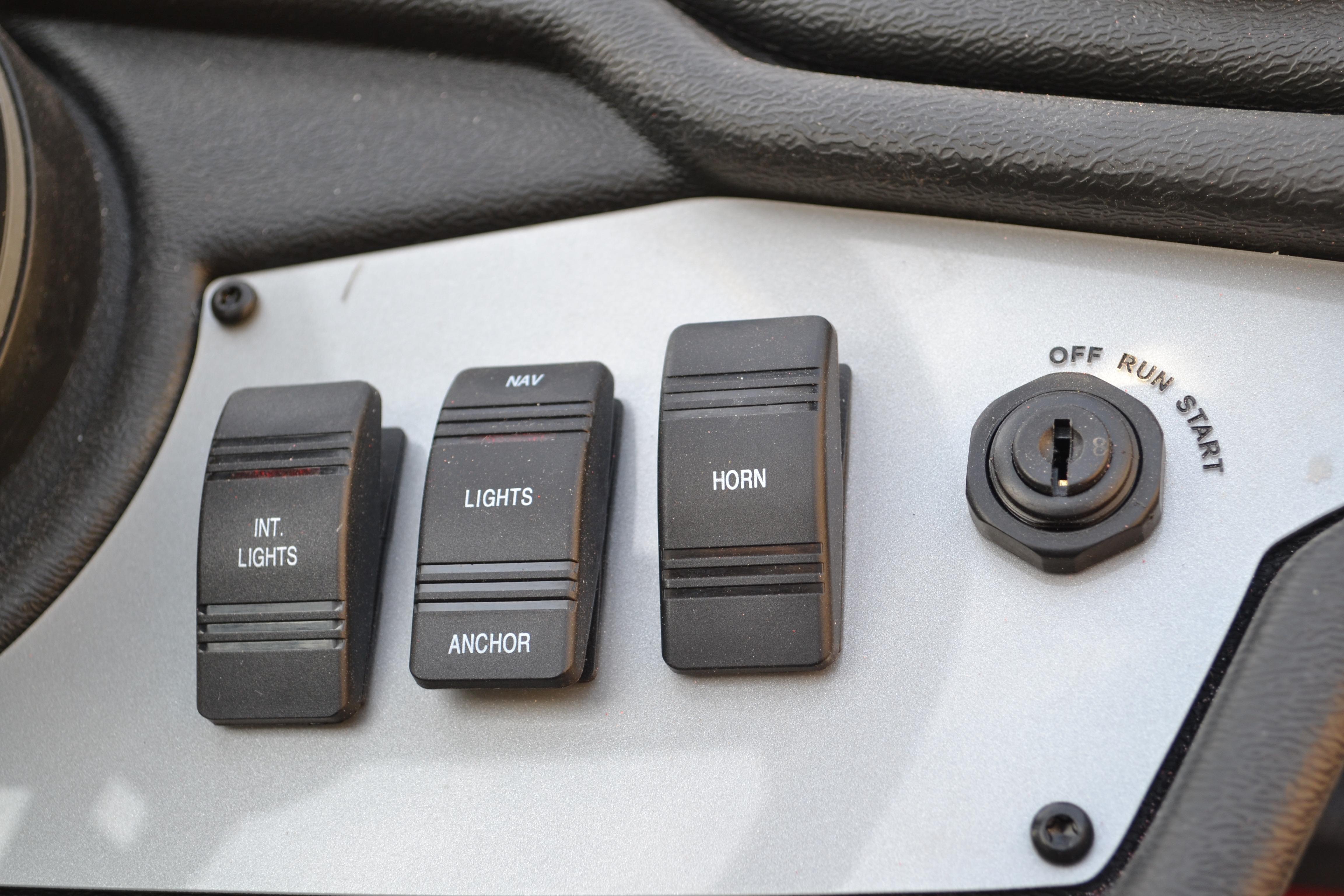 Control panel of 2026 Ranger RT188 boat with switches and ignition.