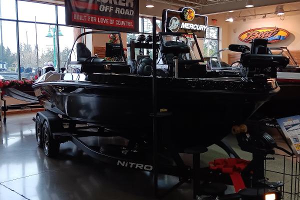 2025 Nitro ZV20 boat displayed indoors with Mercury engine.