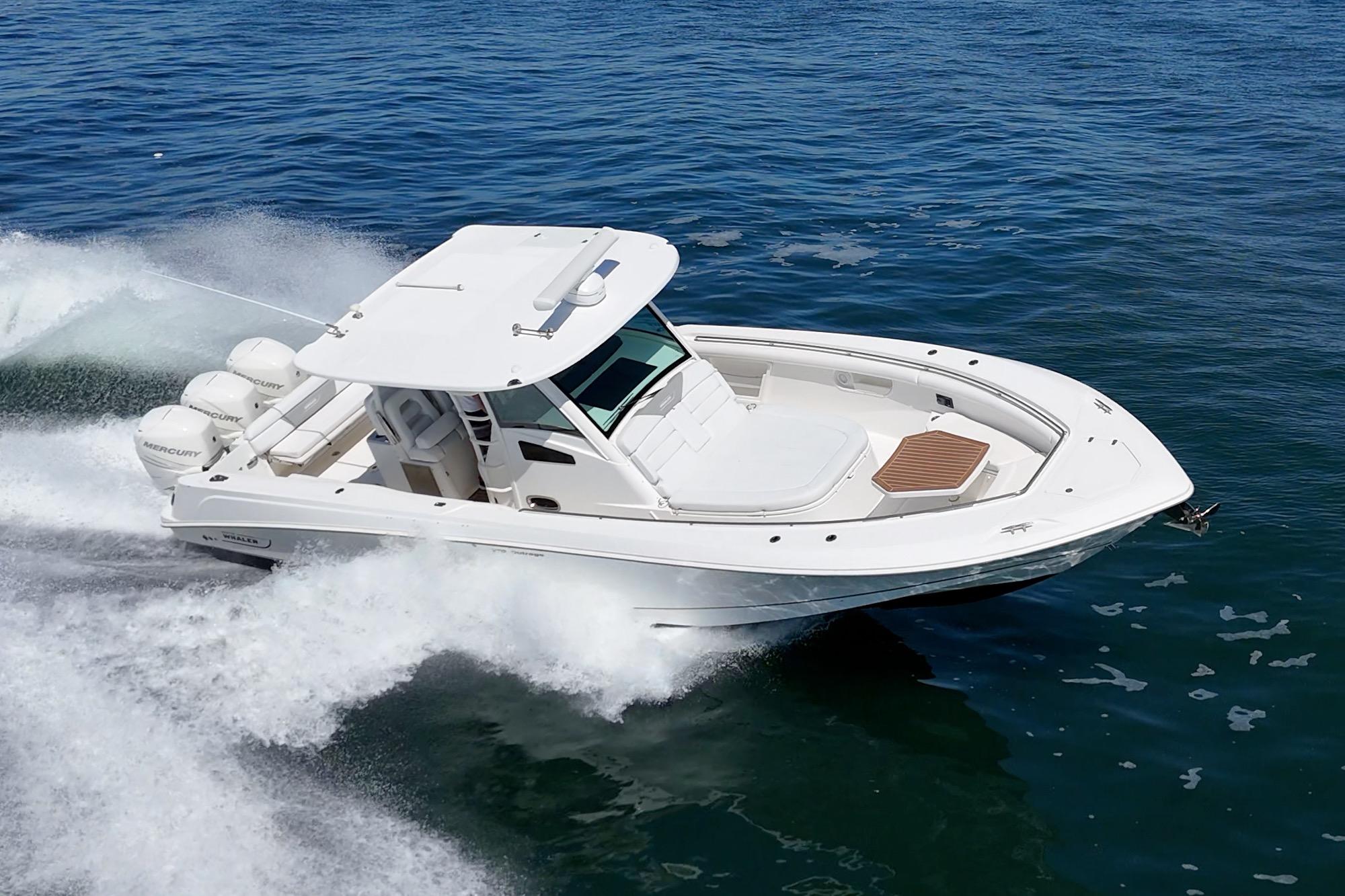2015 Boston Whaler 370 Outrage cruising swiftly on open water.