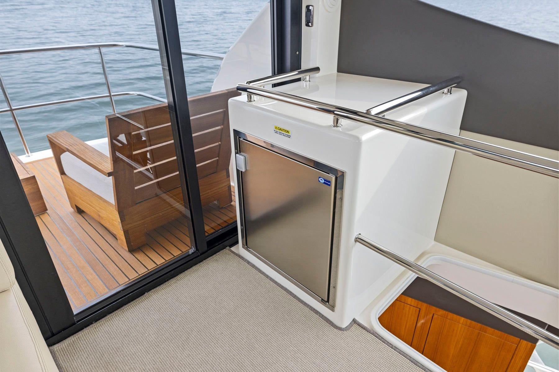 Interior view of 2014 Maritimo M50 yacht, featuring sleek design and outdoor seating area.