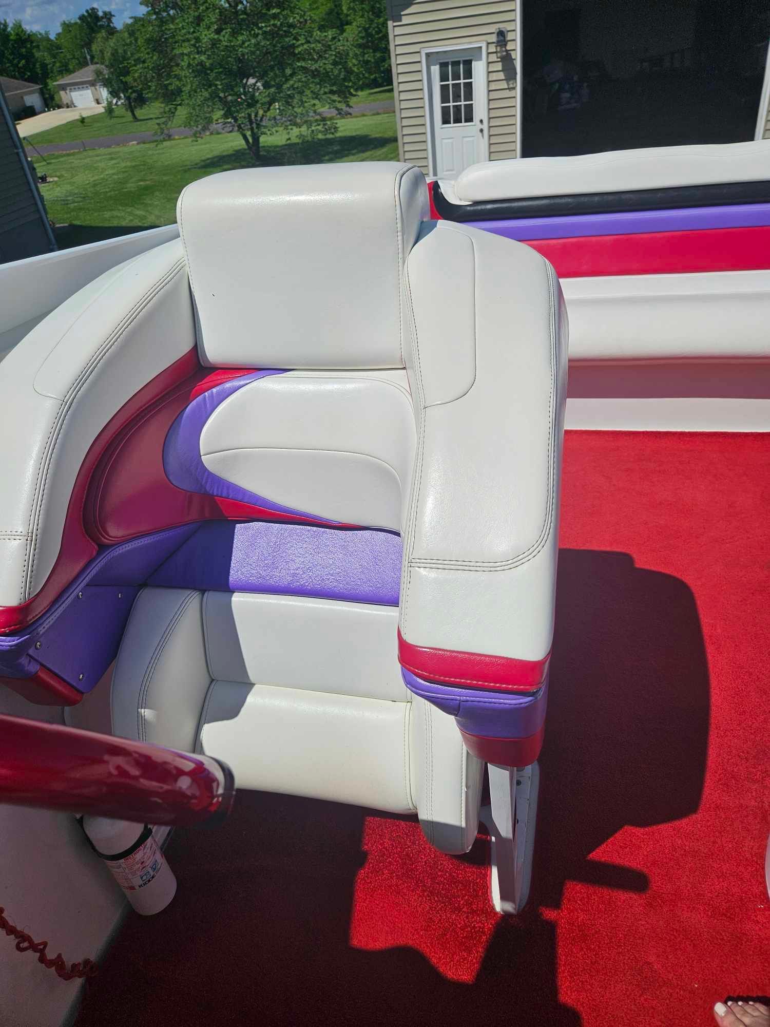 Interior of a 1997 Baja 38 Special Boss boat with colorful seating.