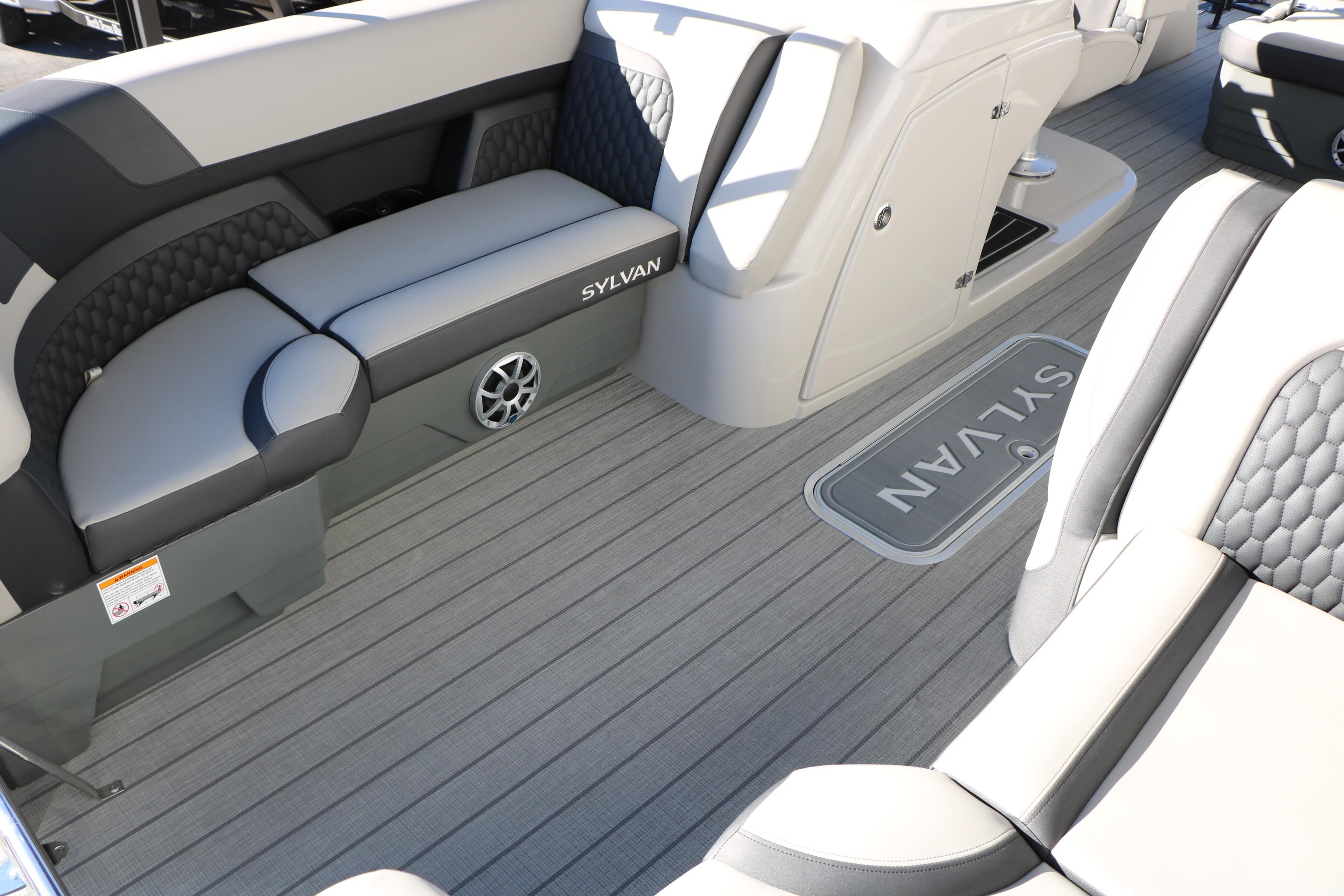 Luxurious interior of 2026 Sylvan L3 CLZ DH boat with stylish seating and flooring.