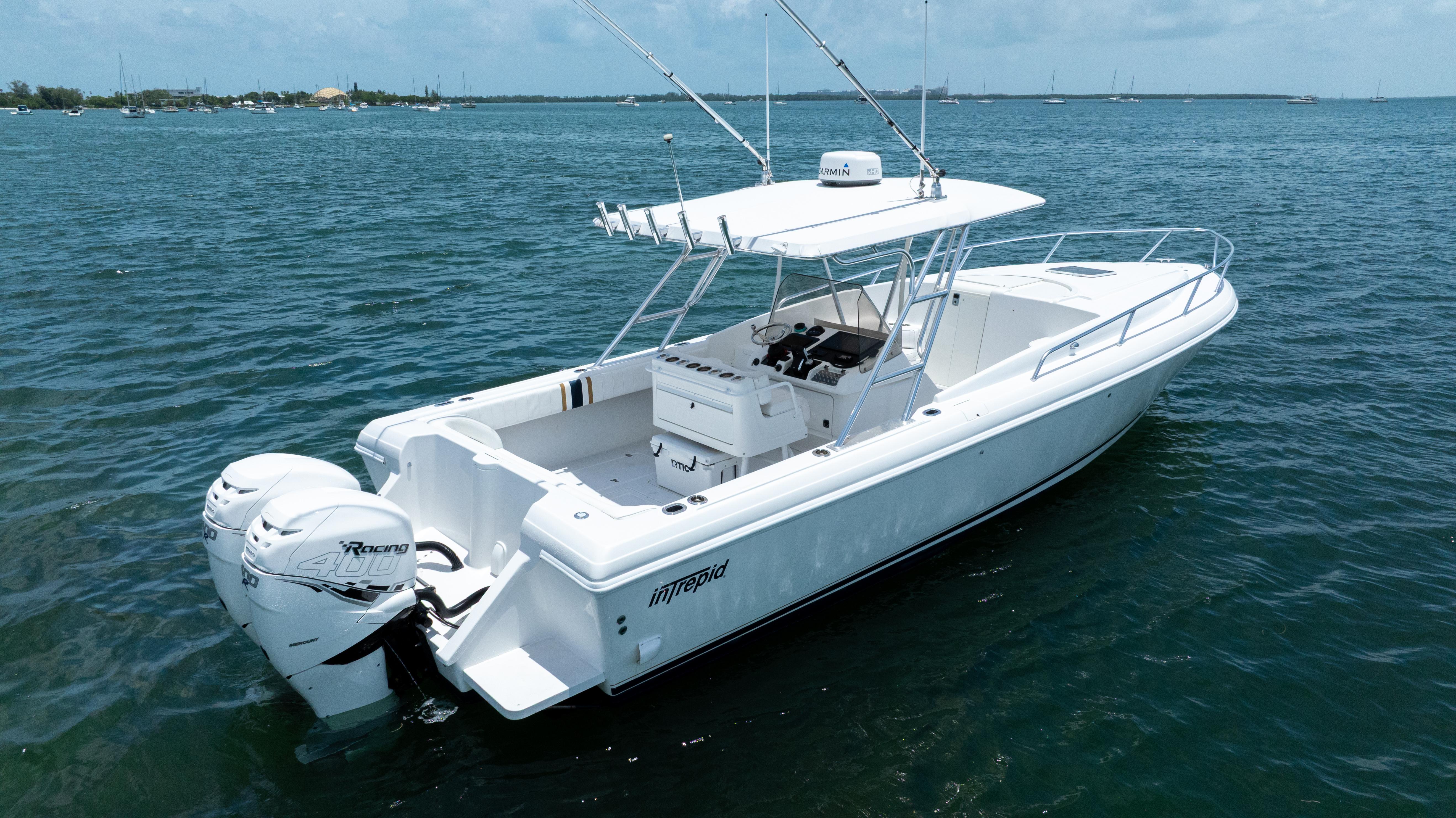 1999 Intrepid 35 boat on calm water, featuring twin outboard engines.
