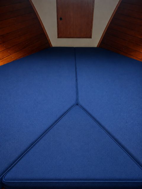 Interior of 1980 Grand Banks 32 Sedan with blue upholstery.