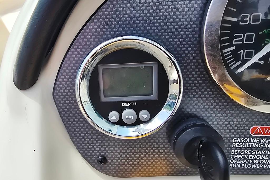 Dashboard of a 2007 Sea Ray 205 Sport boat with depth gauge and speedometer.