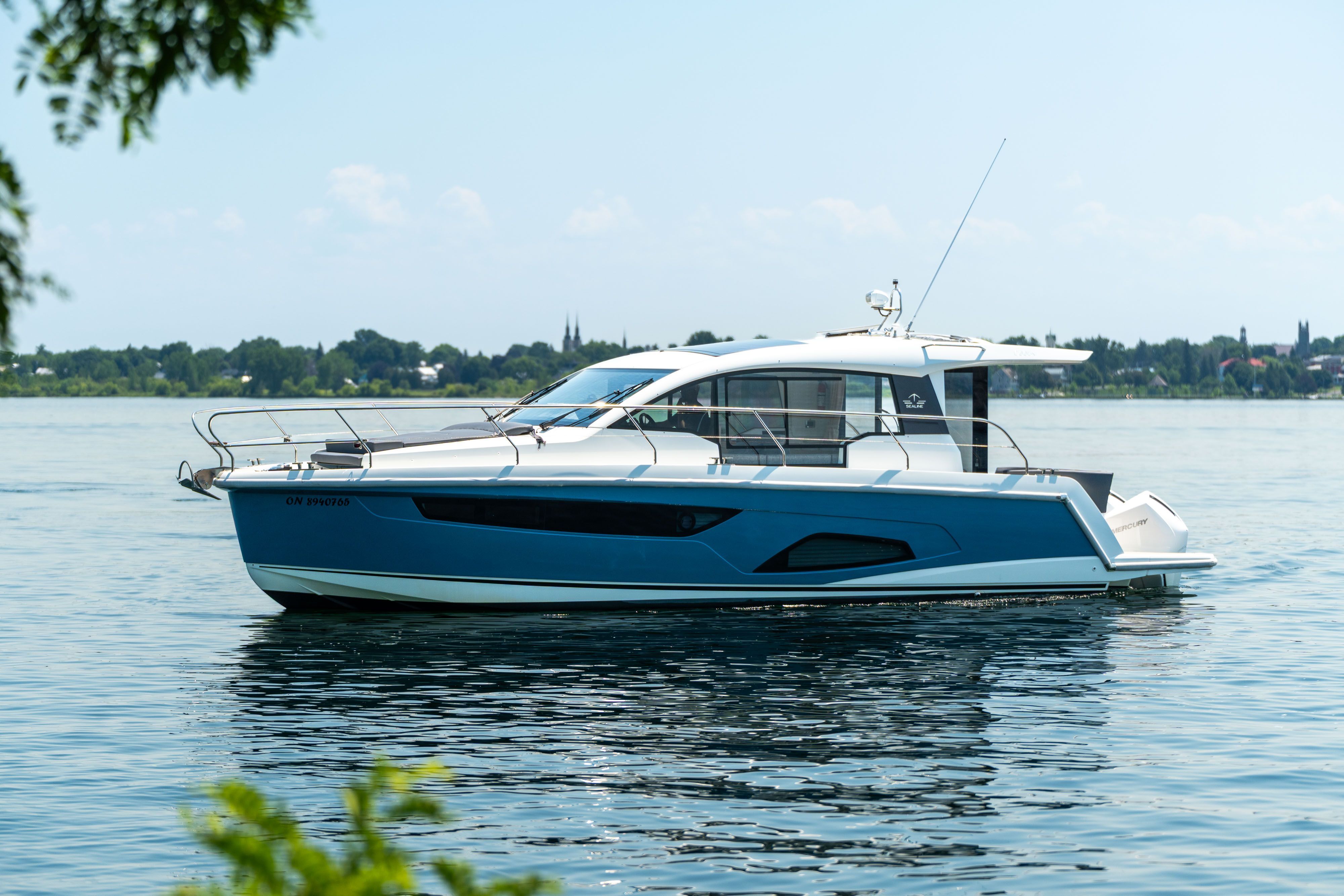 2023 Sealine C335V on calm water, featuring a sleek design and spacious deck.