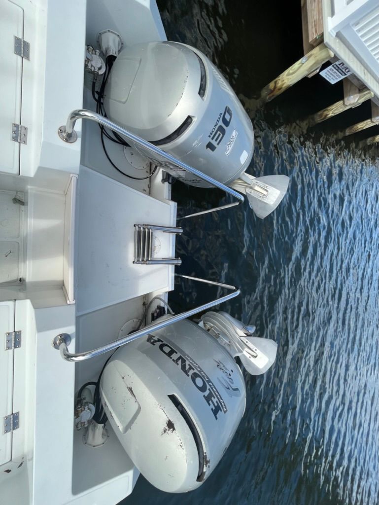 Sea Cat 25s boat with Honda engines at dock, year 1995.